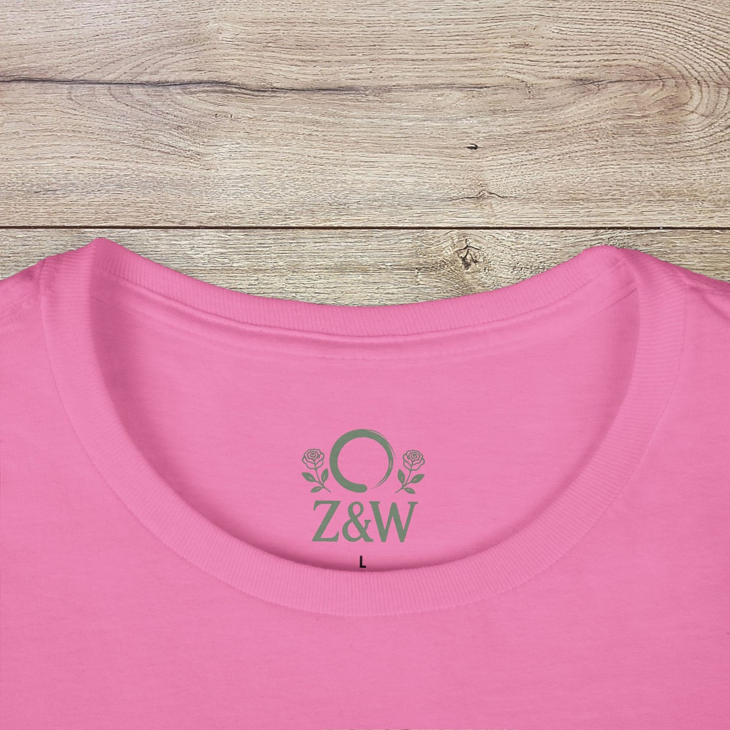 Close-up of the collar of a Funny Pilates T-Shirt with Durable Shoulder Tape, showcasing its classic fit and detailed logo in pink.