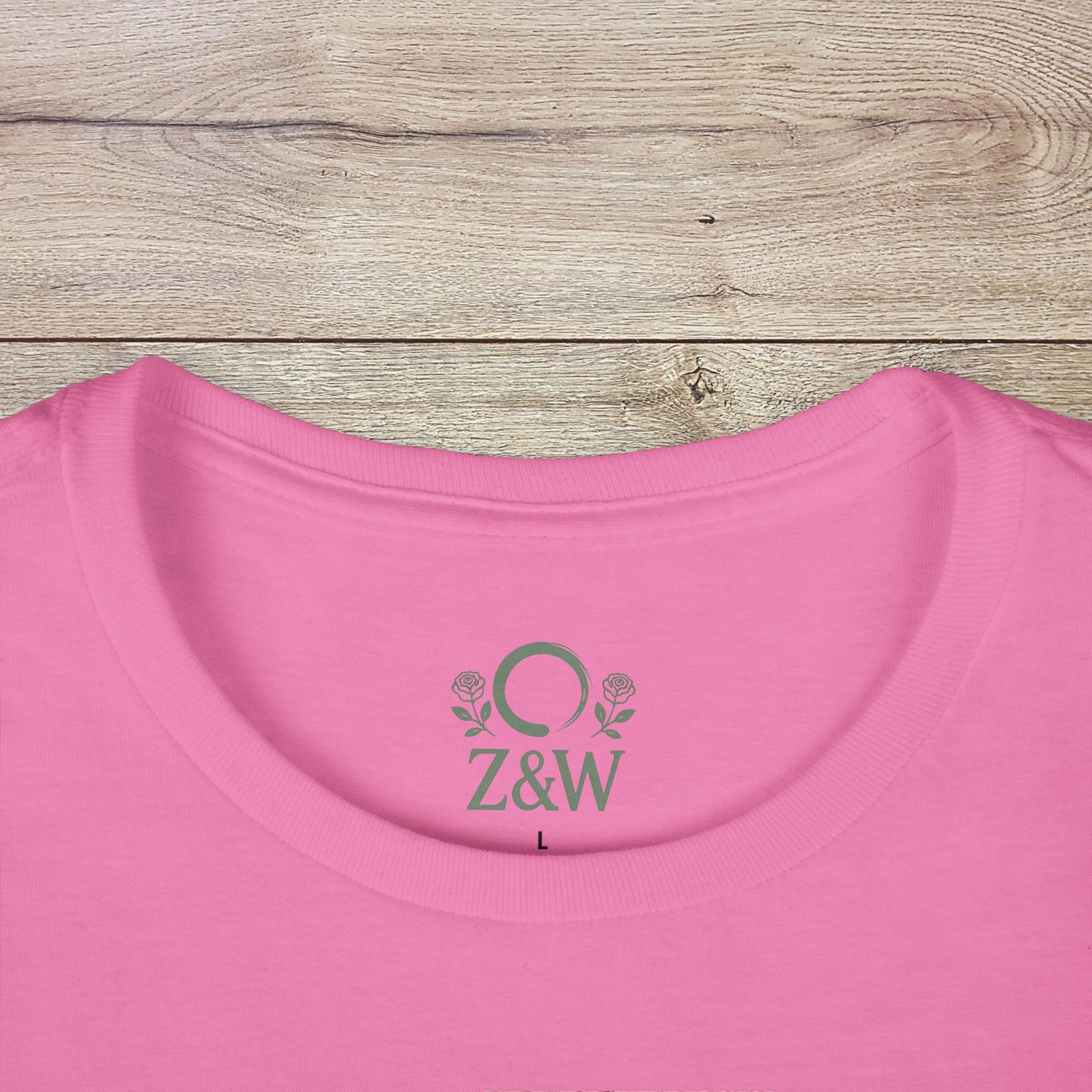 Close-up of the collar of a Funny Pilates T-Shirt with Durable Shoulder Tape, showcasing its classic fit and detailed logo in pink.