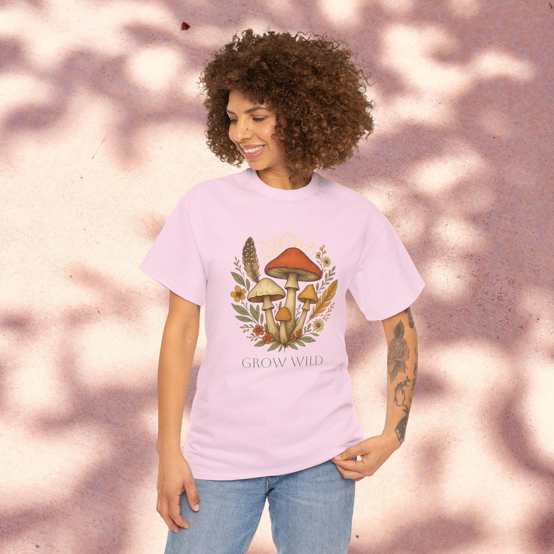 Wild Mushroom Graphic Tee in soft pink, displaying a charming mushroom design with floral accents, an excellent addition to any nature lover's wardrobe.