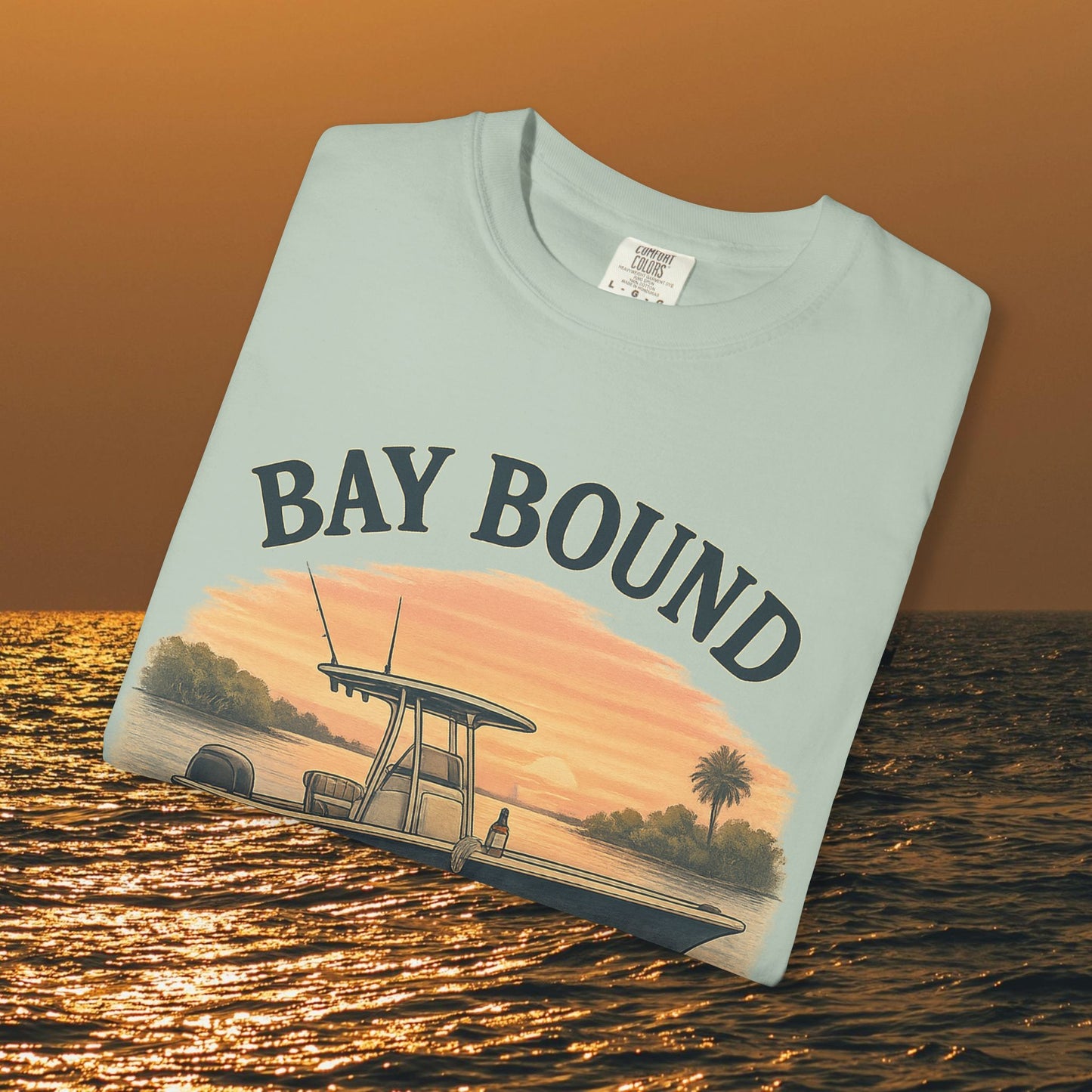 Bay Bound T-Shirt for Summer displayed on water background, perfect for fishing and beach lovers. Soft cotton material in a tranquil blue color.