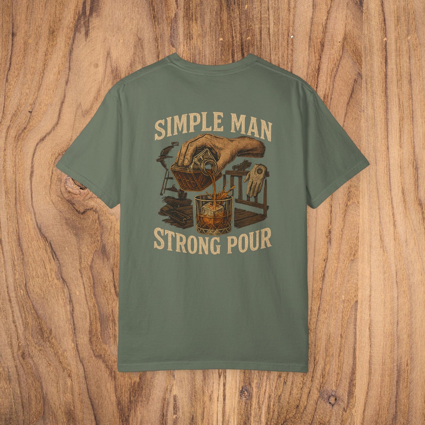 Simple Man Strong Pour T-Shirt in olive green with a vintage design of a hand pouring into a glass, combining style and comfort for any occasion.