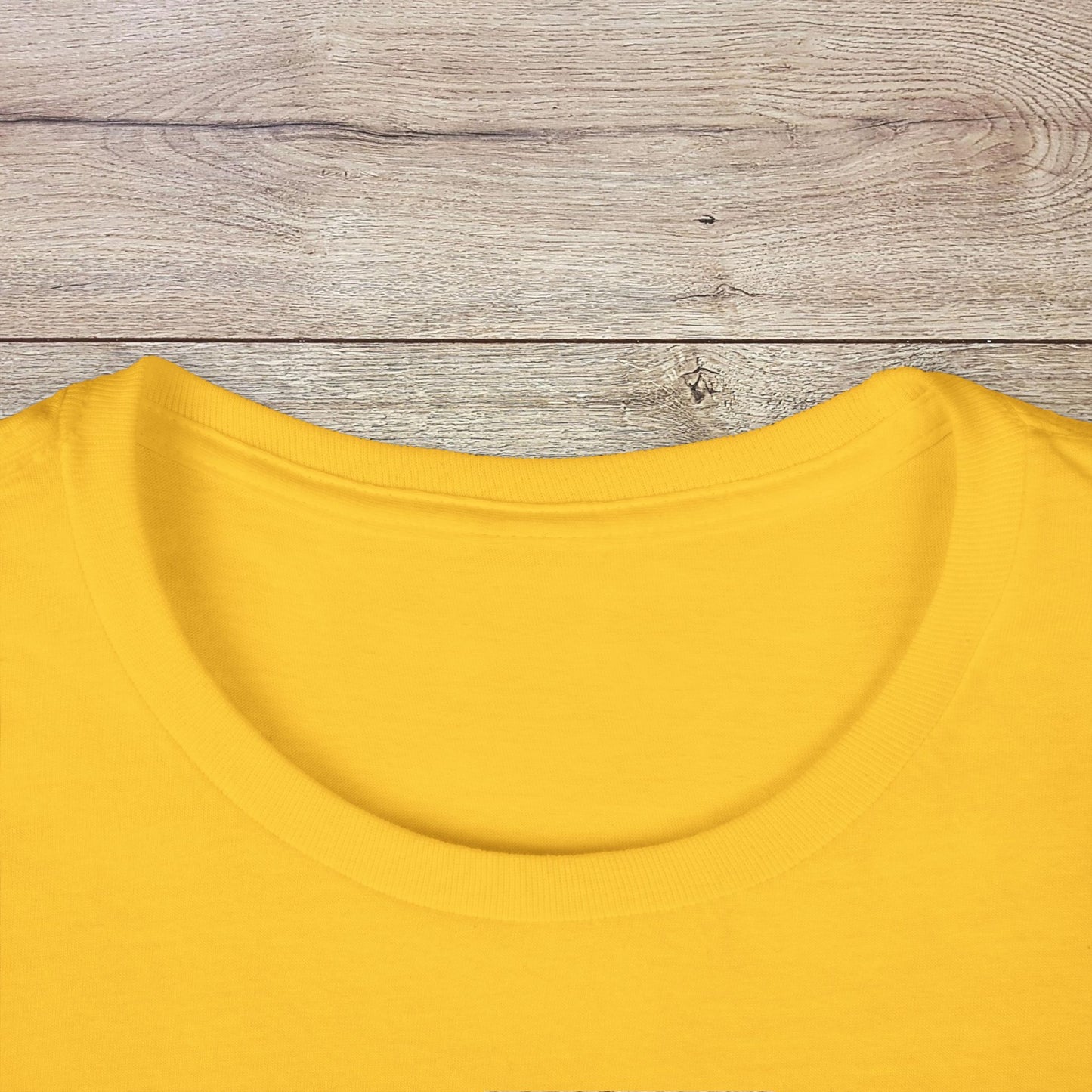 Close-up of the collar of the Golf Wives Social Club Tee in yellow, highlighting the quality of the fabric and design.