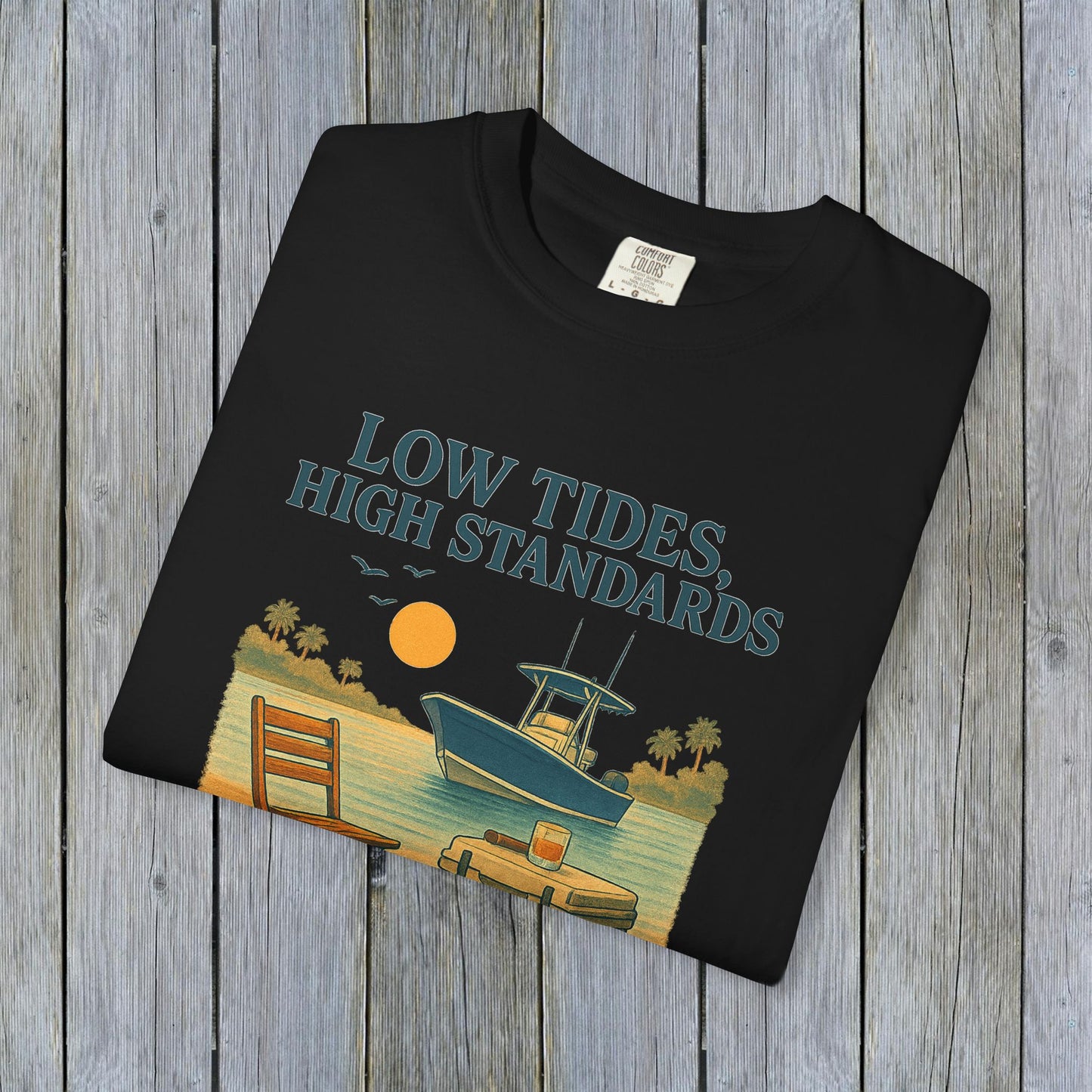 Garment-Dyed Low Tides High Standards T-Shirt in black showcasing a boat on the water and a sunset, perfect for casual hangouts and showcasing a relaxed vibe.