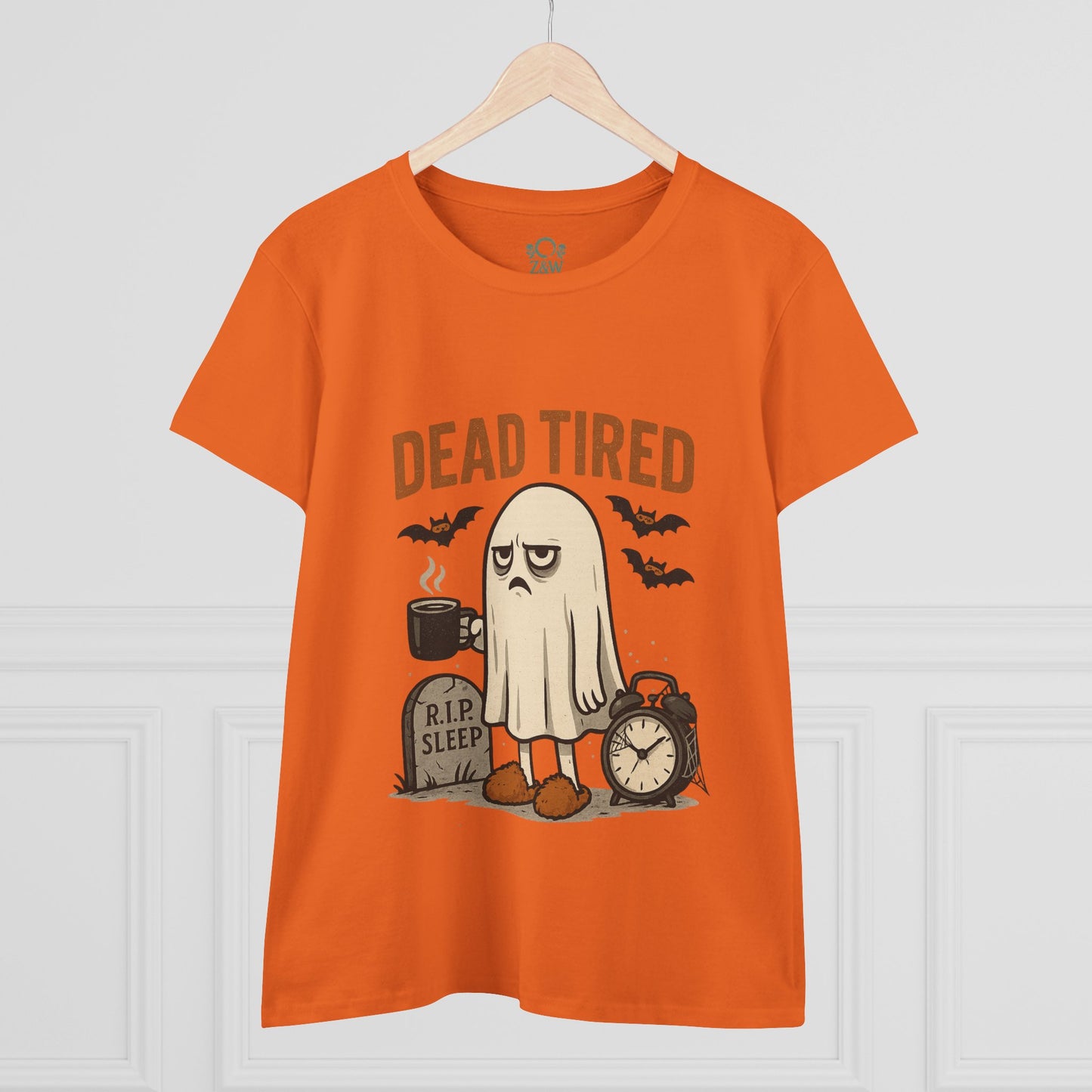 Cute Whimsical Ghost T-Shirt for Halloween showcased in orange on a hanger, featuring a sleepy ghost and 'DEAD TIRED' text, a stylish and fun gift option.