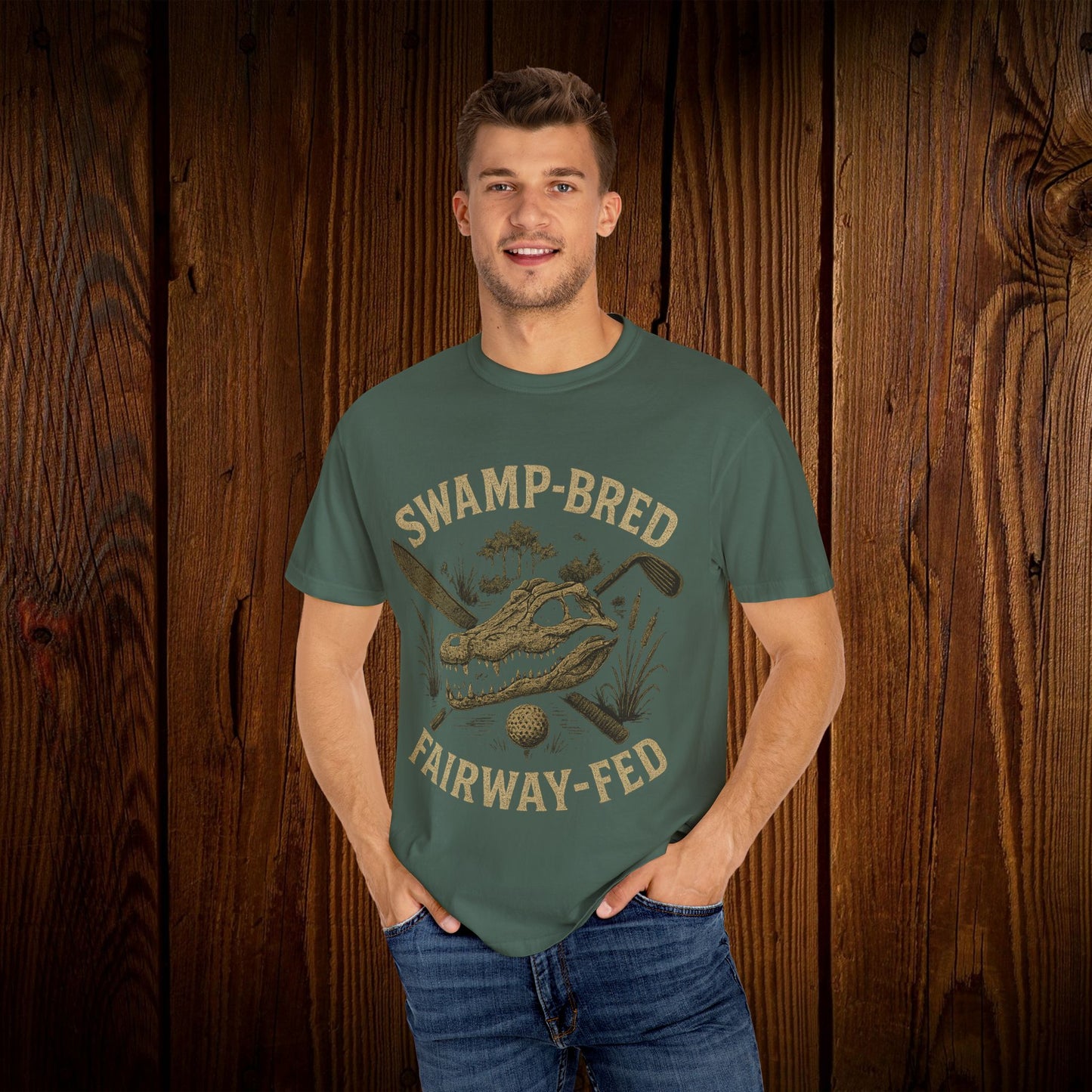 Model wearing the Unisex Swamp-Bred Fairway-Fed Tee in earthy green, featuring a unique graphic design that highlights the golf theme, providing a comfortable fit.