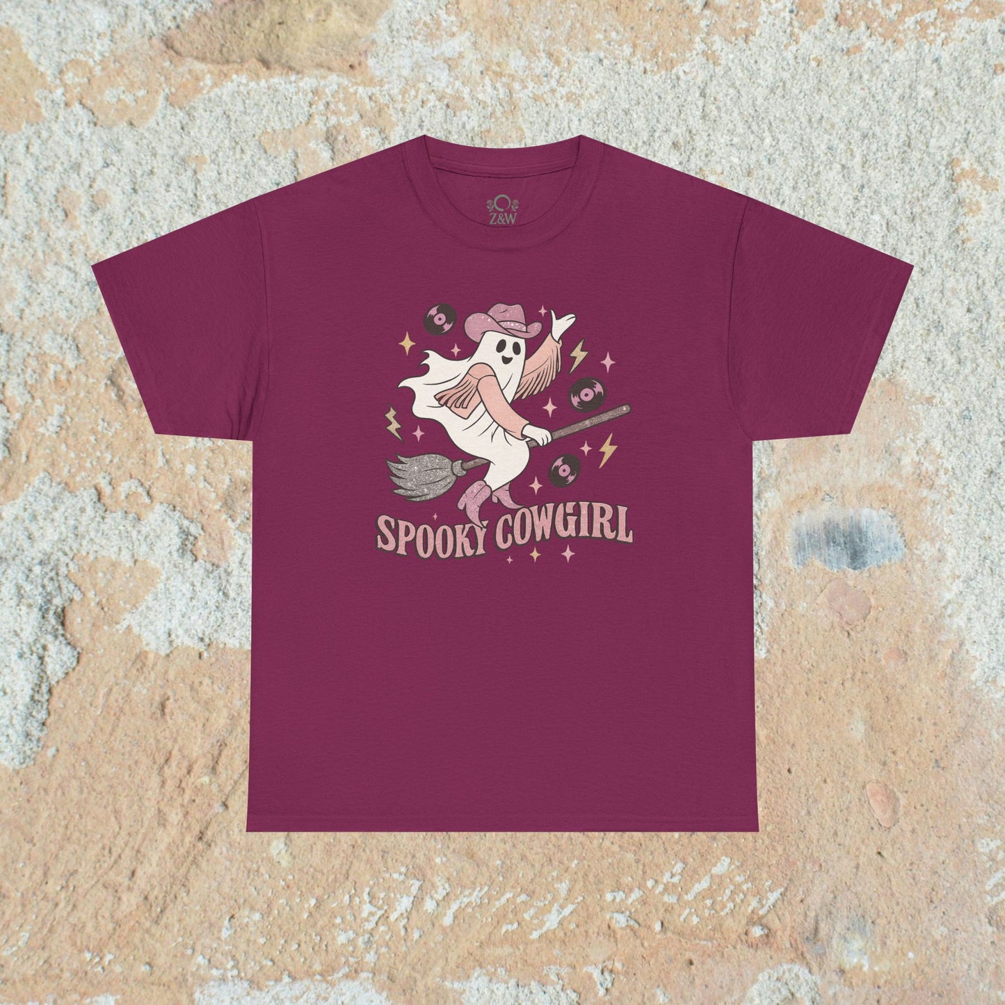 Spooky Cowgirl Graphic Tee in deep maroon, highlighting a fun ghostly cowboy character ready for a spooky celebration, ideal for trendy casual outfits.