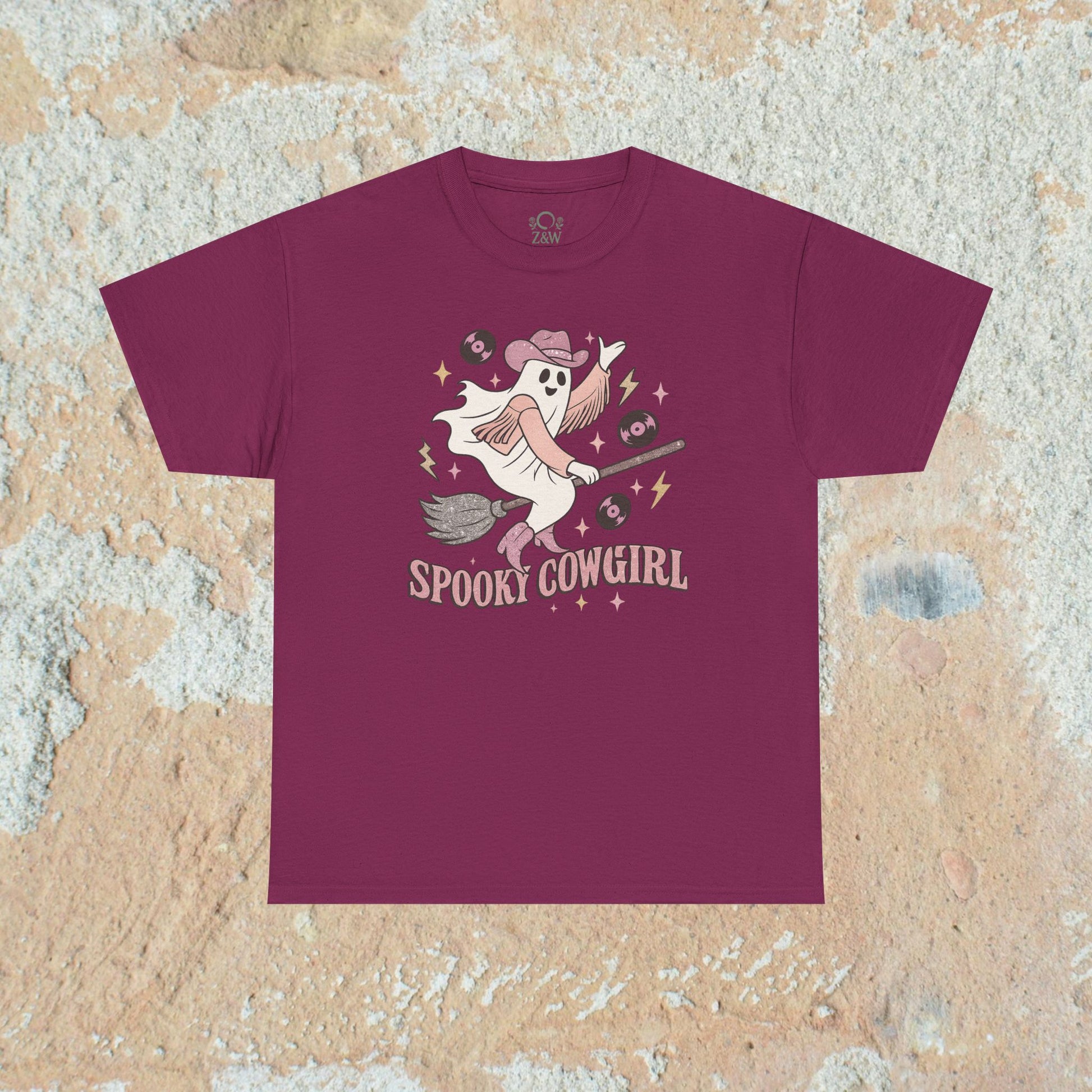 Spooky Cowgirl Graphic Tee in deep maroon, highlighting a fun ghostly cowboy character ready for a spooky celebration, ideal for trendy casual outfits.