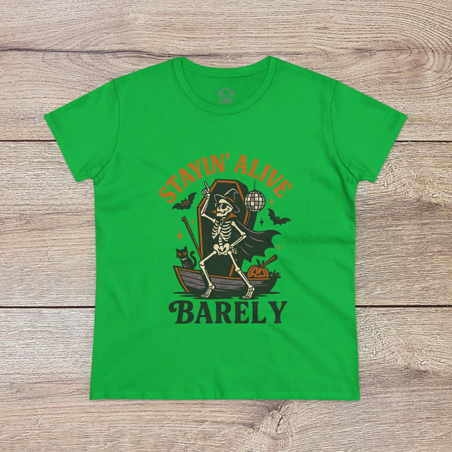 Stayin’ Alive T-Shirt in bright green with a whimsical skeleton graphic, making it a fun choice for Halloween. Comfortable unisex softstyle apparel.