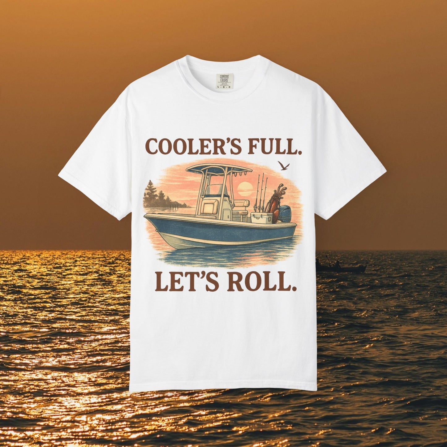 Men's & Women's Durable Cotton Full Tee shown on a scenic sunset background, featuring a boat graphic and the text 'COOLER'S FULL. LET'S ROLL.' designed for comfort and style.