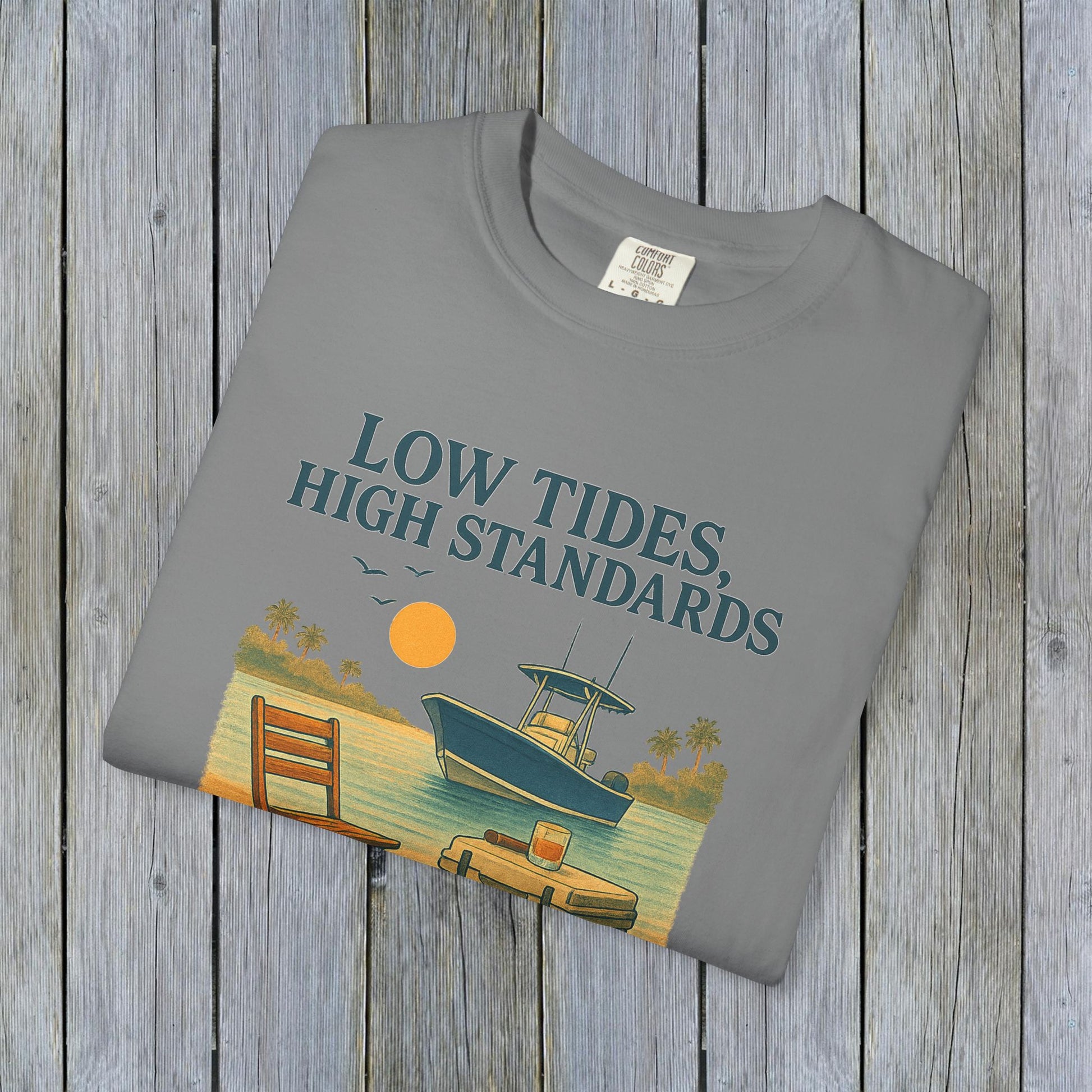 Garment-Dyed Low Tides High Standards T-Shirt in gray featuring a serene boat scene and sunset, designed for comfort and casual elegance.