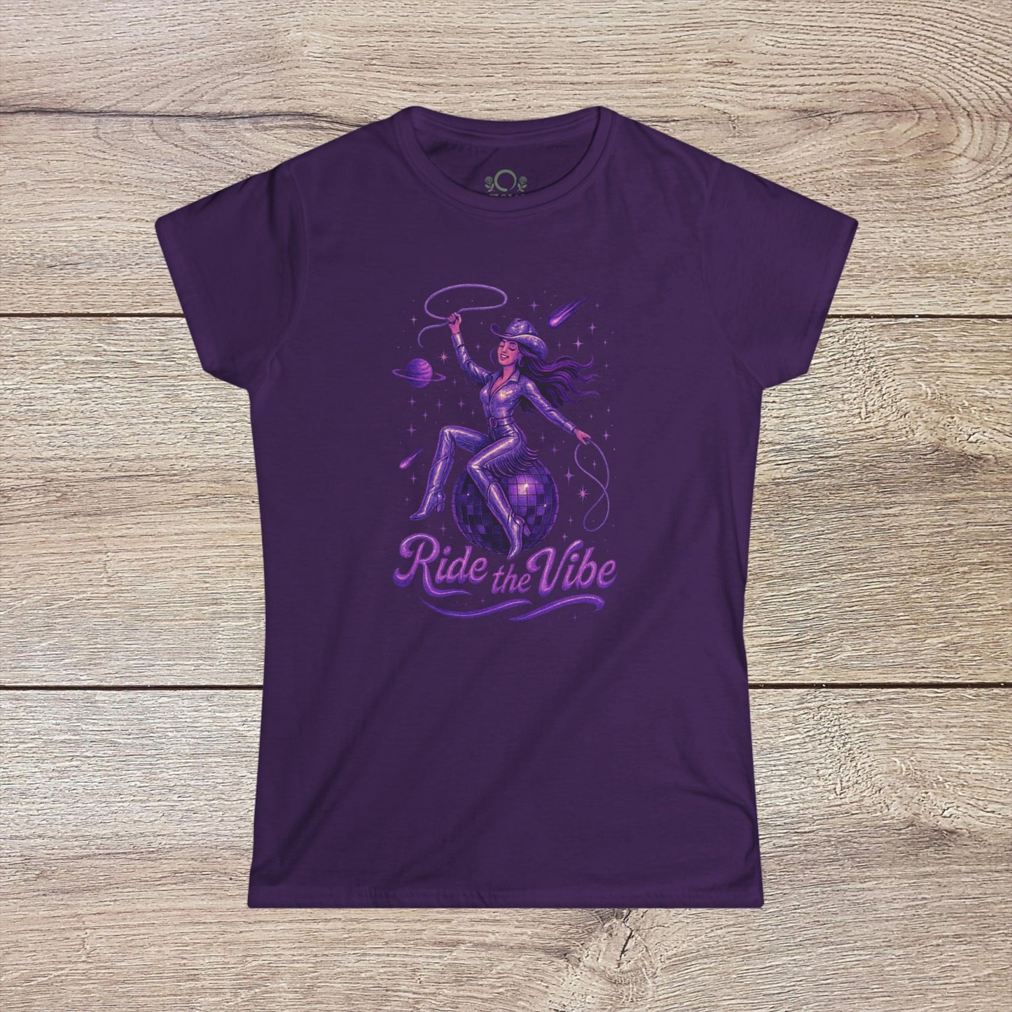 Vibrant Ride The Vibe Tee in deep purple highlighting a striking graphic of a woman riding a planet, produced with high-quality 100% ring-spun cotton.