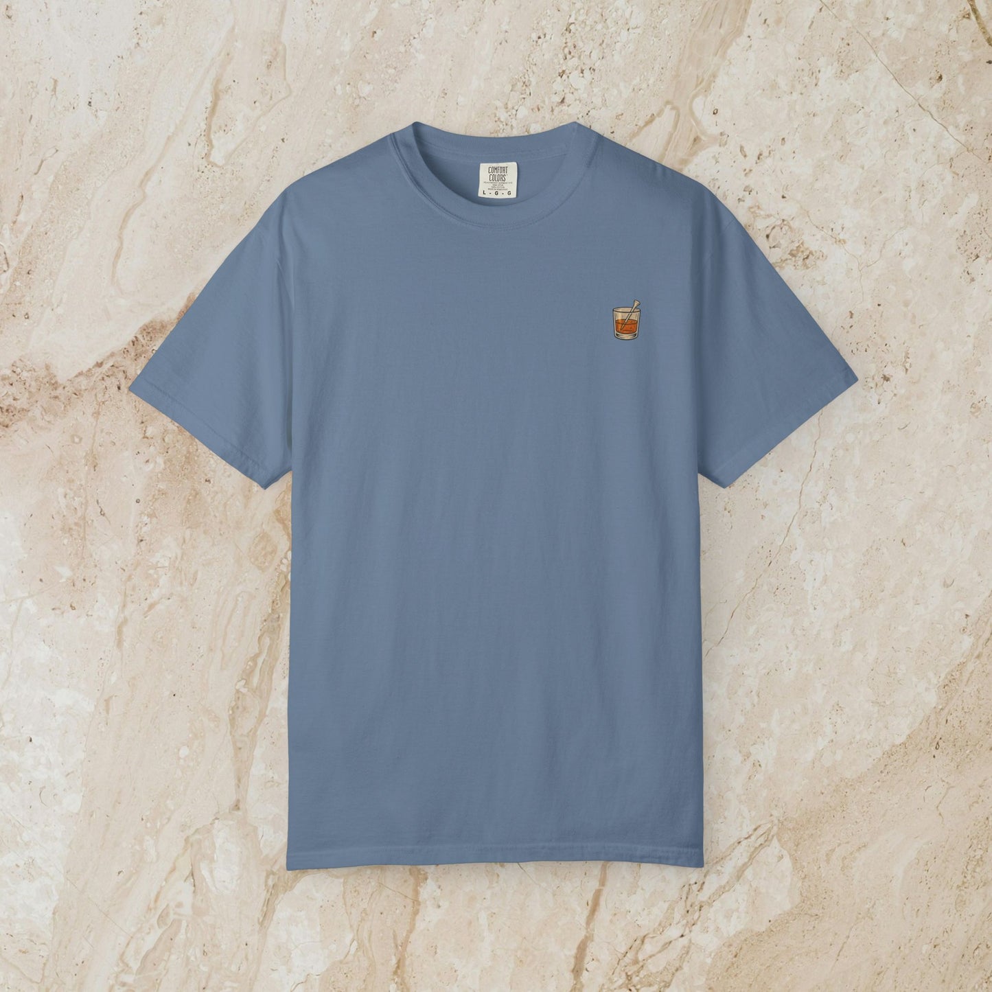 Golden Whiskey Dog Tee in light blue color, featuring a unique vintage style, made from 100% cotton with a relaxed fit and left chest pocket.