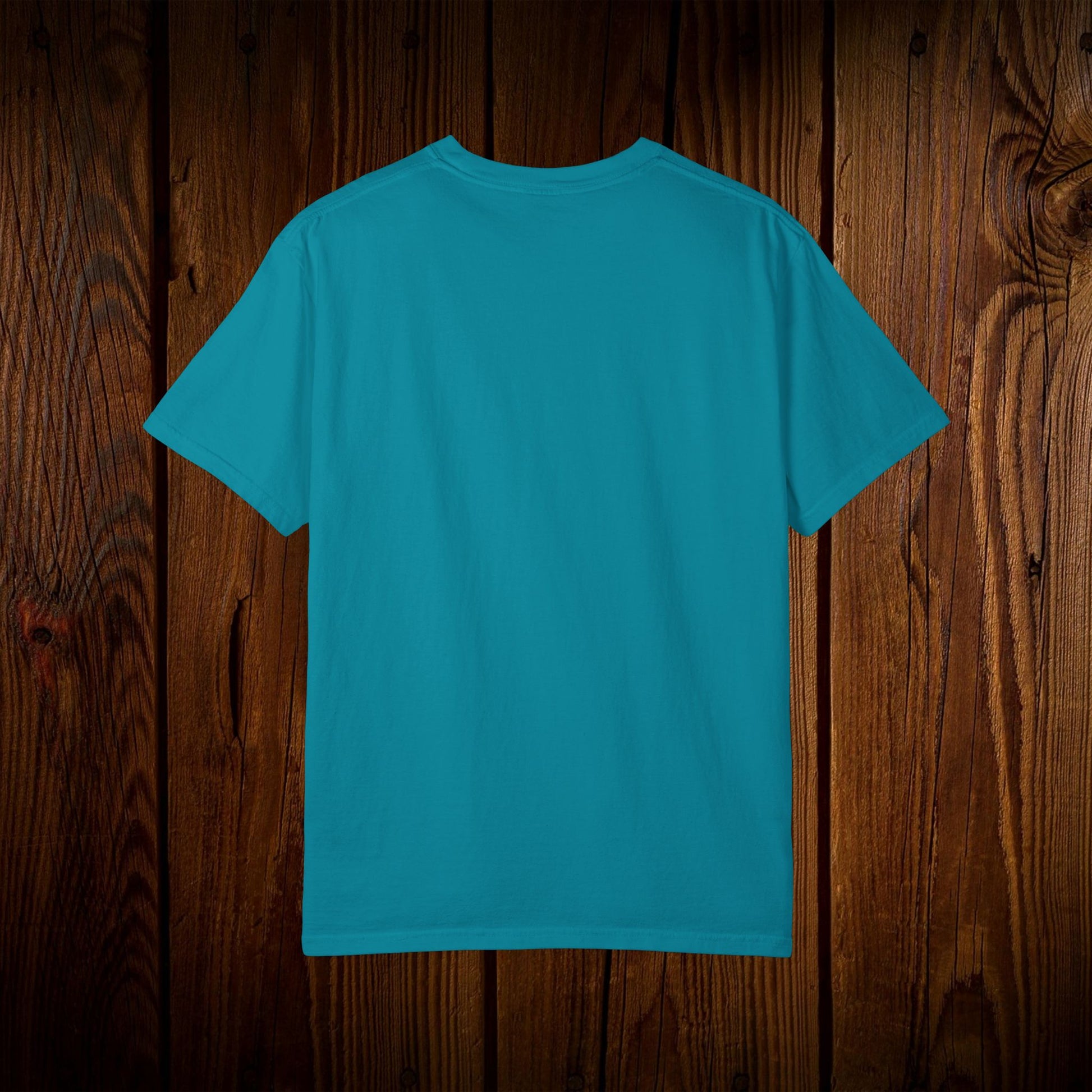 Back view of the Unisex Swamp-Bred Fairway-Fed Tee in vibrant turquoise, demonstrating its simple and clean design, ideal for everyday wear.