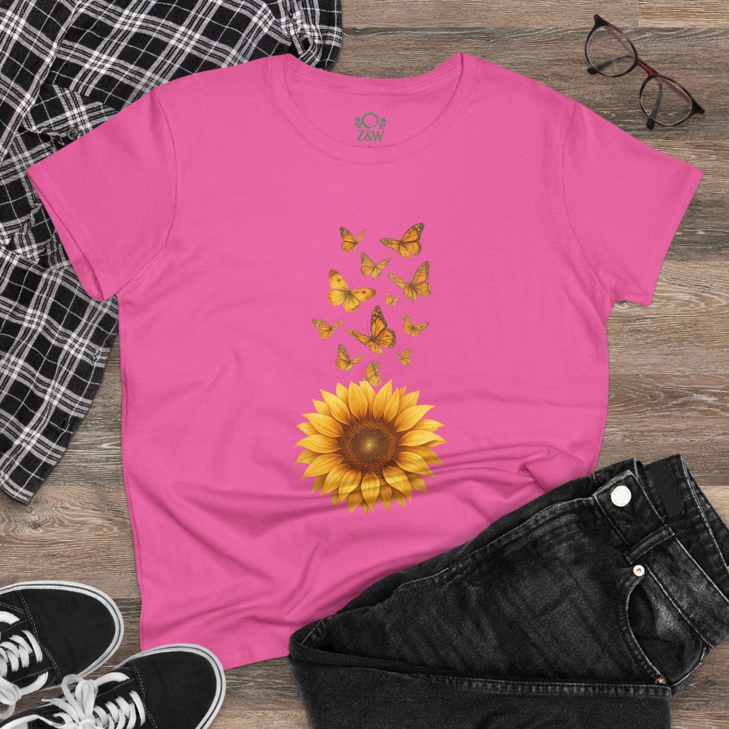 Sunflower & Butterflies Cotton Tee for Women laid flat in pink, showcasing its unique sunflower graphic and butterflies design with casual styling.