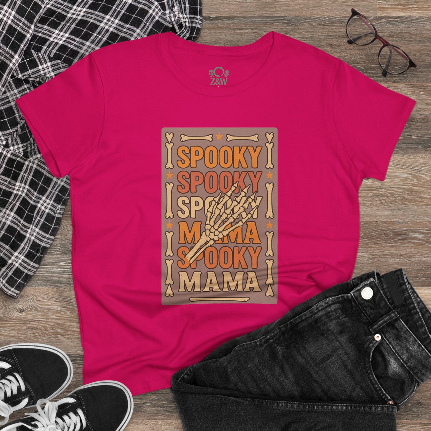 Spooky Mama Tee in vibrant pink featuring a playful graphic design with spooky lettering, made from soft cotton for comfort and style.