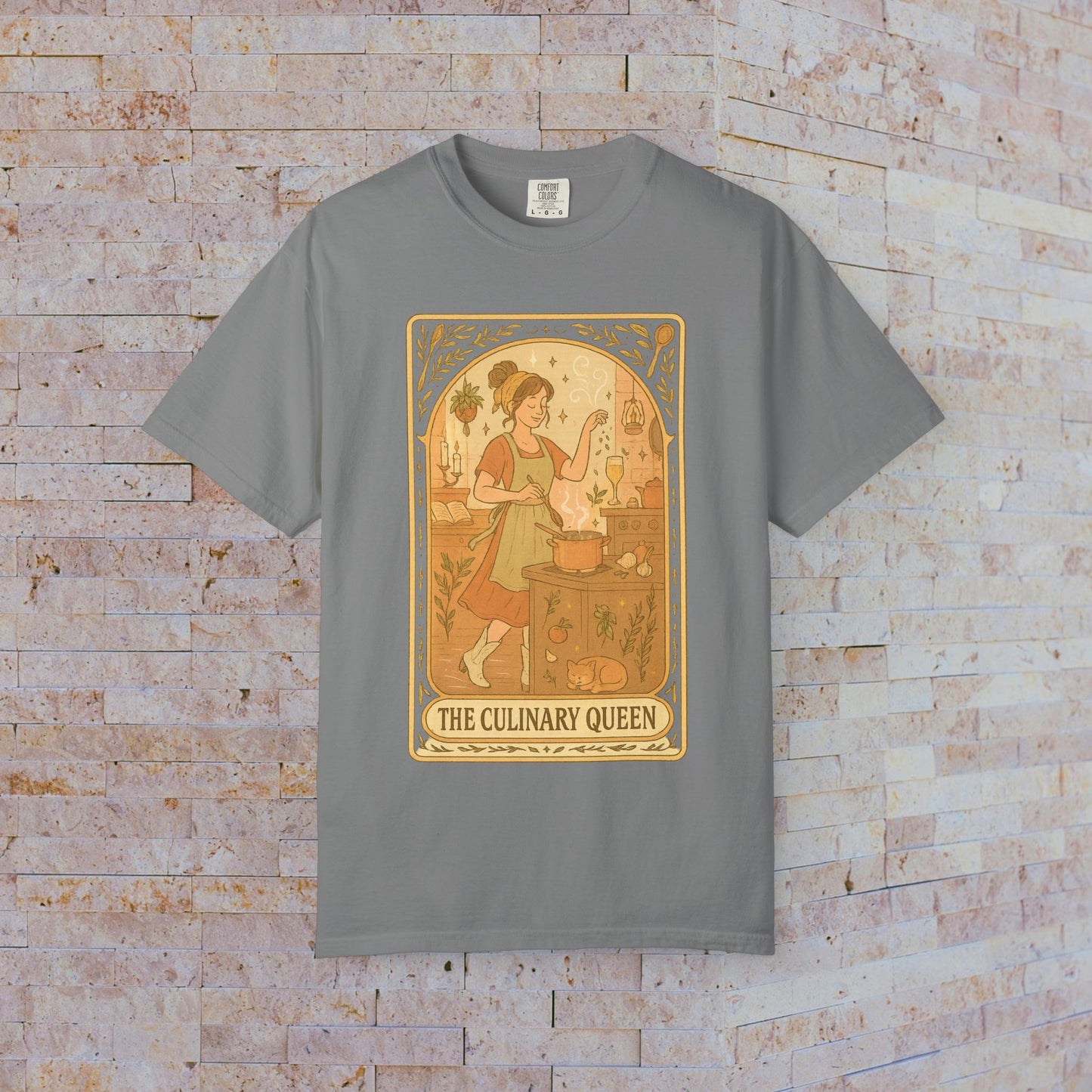 Culinary Queen Tarot Tee in grey, featuring a unique design with a girl cooking and a whimsical vibe. Available in sizes S to 4XL, made from soft, pre-shrunk cotton.