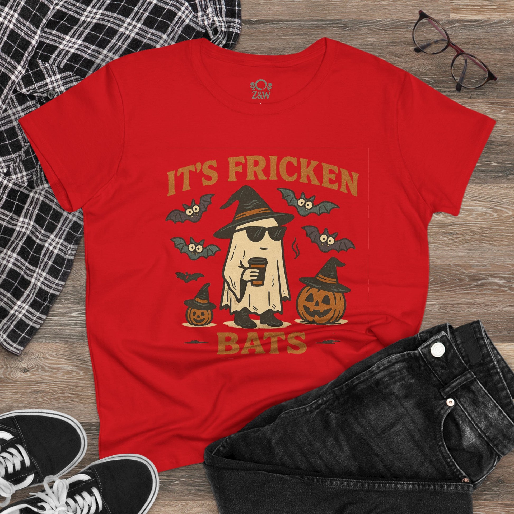 Halloween Unisex T-Shirt featuring a fun graphic of a ghost with sunglasses, bats, and jack-o'-lanterns, made from 100% cotton, perfect for trick-or-treating.