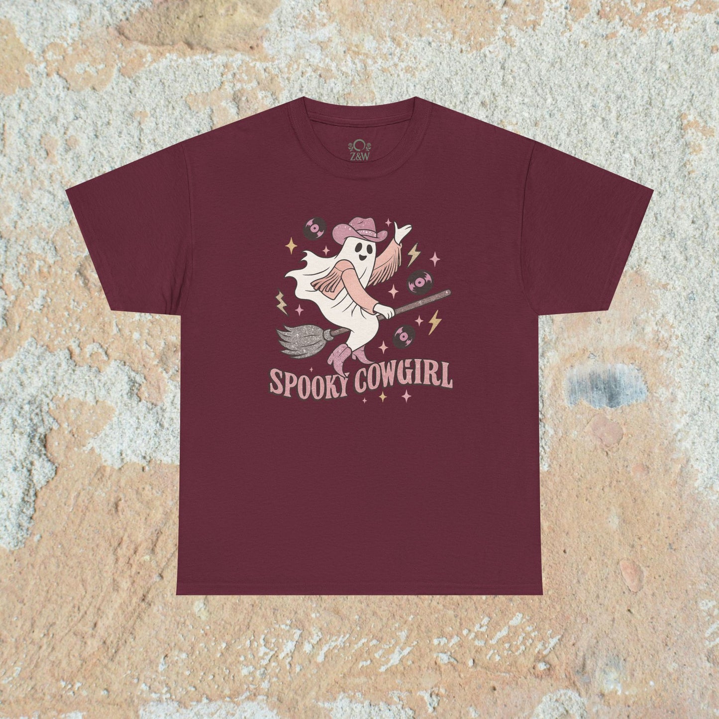 Spooky Cowgirl Graphic Tee in rich maroon, featuring a charming ghost with a cowboy hat and broom, capturing a playful Halloween spirit.