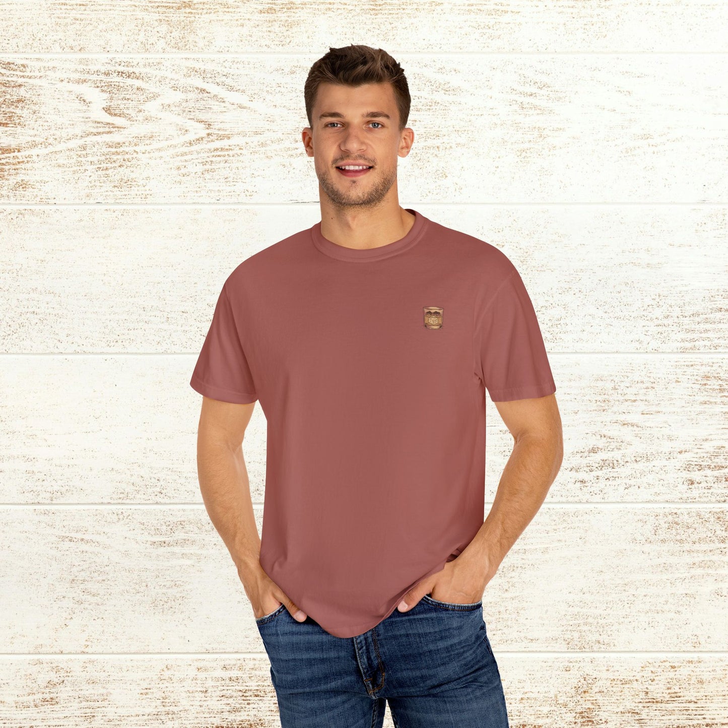 Model wearing the Rodeo On The Rocks Tee in a warm blush color, showcasing its soft 100% US cotton fabric, ideal for casual wear.