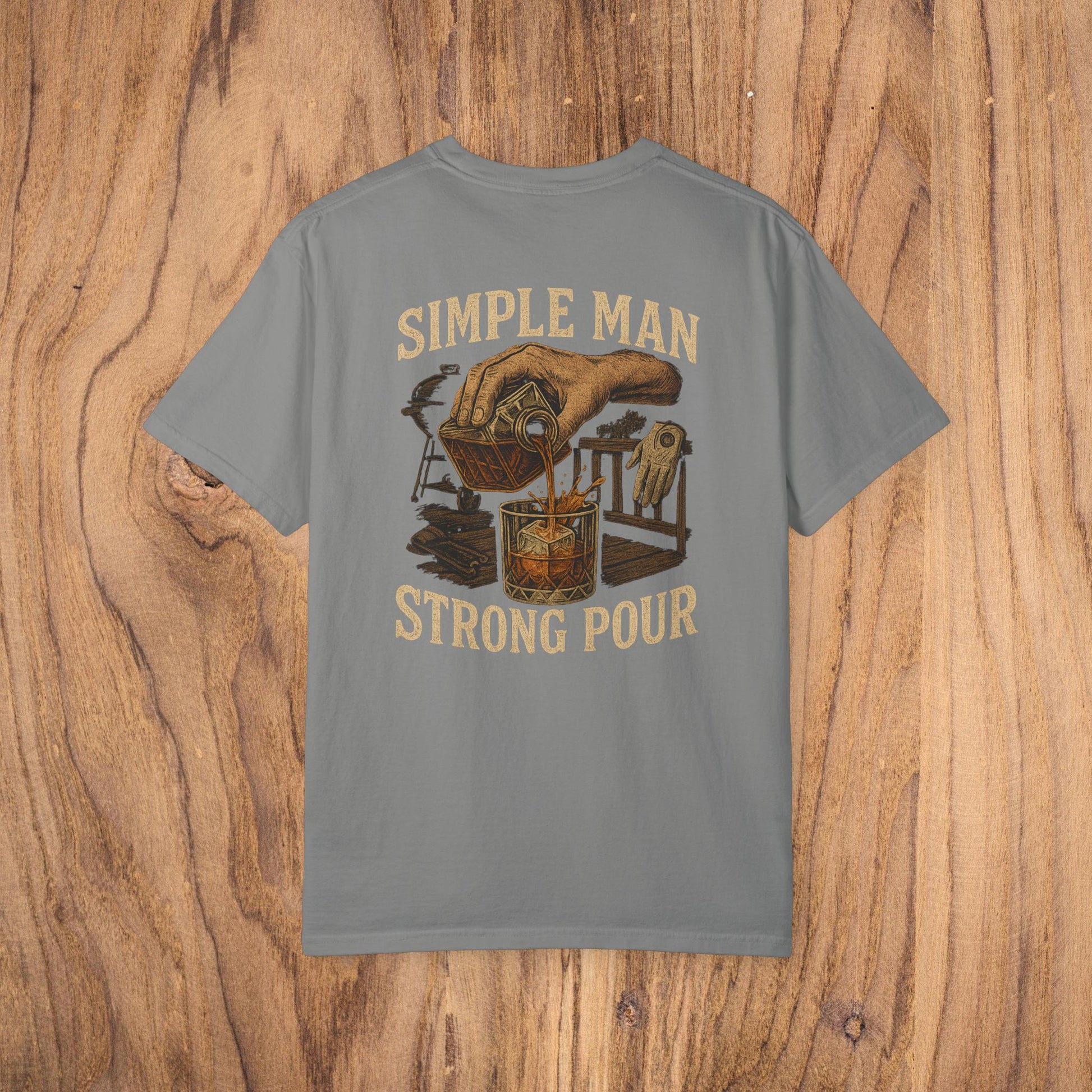Simple Man Strong Pour T-Shirt in gray featuring a detailed illustration of a hand pouring a drink, perfect for casual wear and made from 100% cotton.