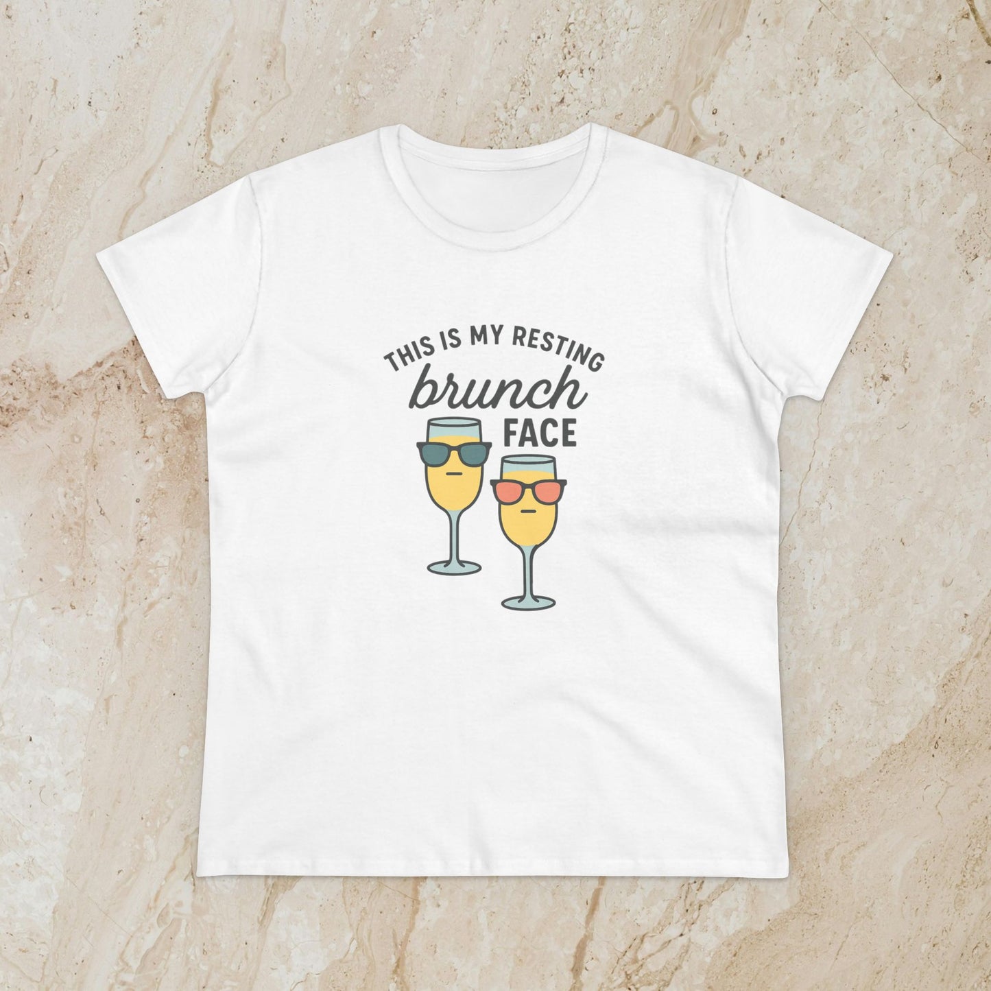Women's Premium 100% Cotton Brunch Face Tee in white featuring a playful design with two cocktail glasses wearing sunglasses and the text 'THIS IS MY RESTING brunch FACE'. Comfortable and stylish for brunch lovers.