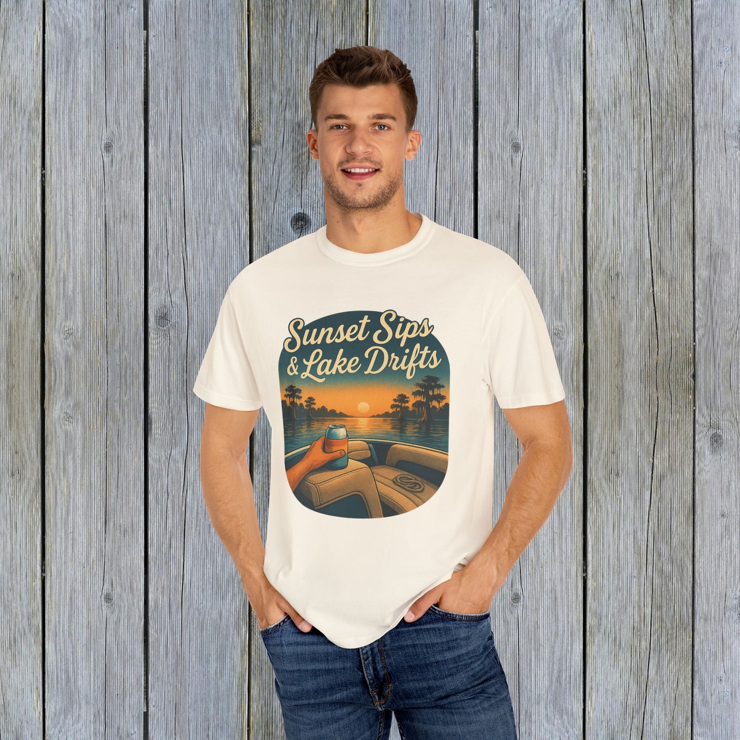 Man wearing Lake Drifts T-Shirt featuring a sunset and lake design, promoting comfort with its 100% cotton fabric.