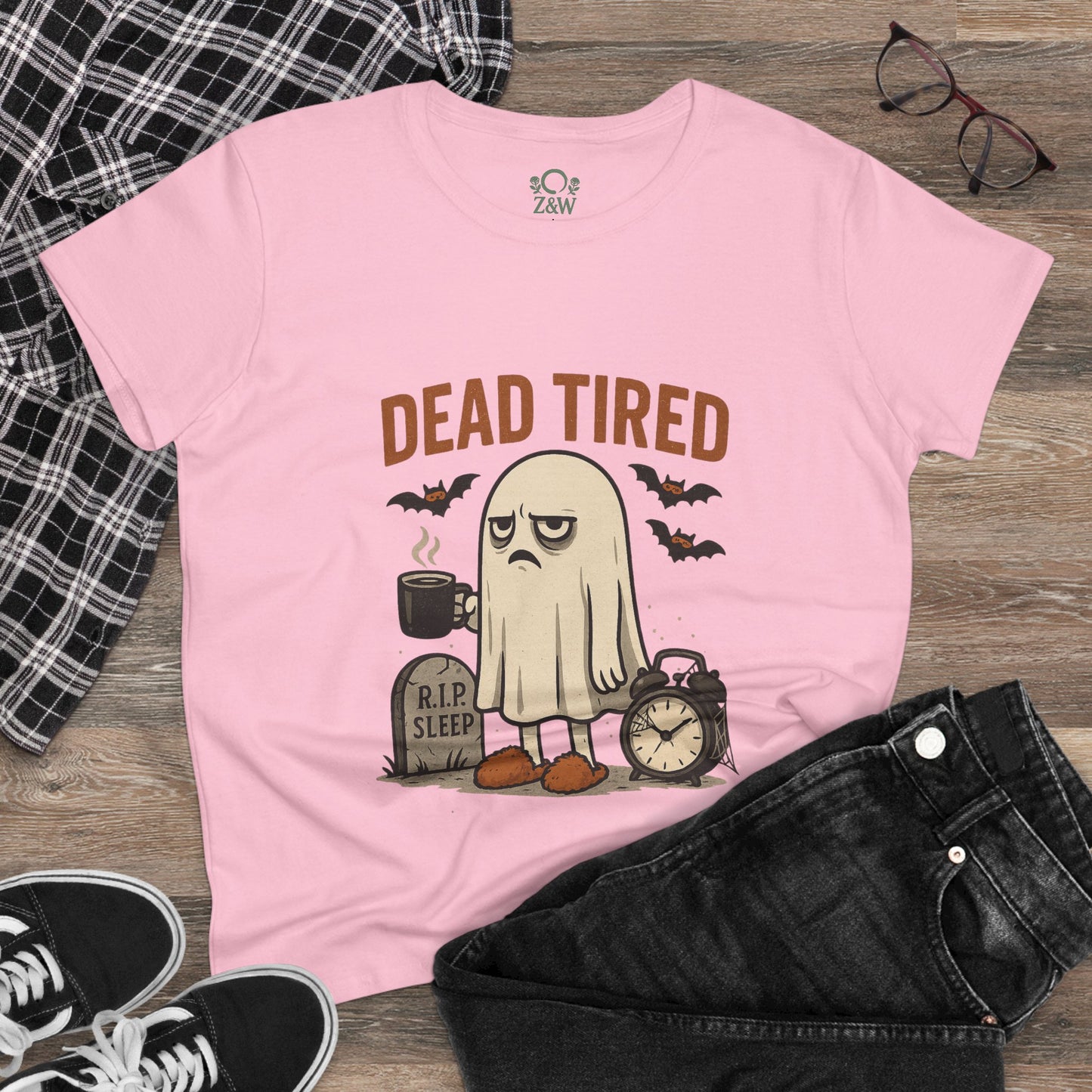 Cute whimsical ghost t-shirt for Halloween featuring the text 'Dead Tired', designed for comfort with 100% cotton, perfect for cozy lounge wear and gift giving.