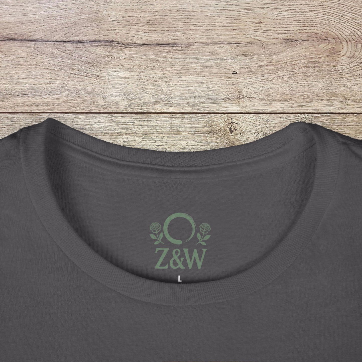 Close-up of the neckline on a dark grey Funny Pilates T-Shirt with durable shoulder tape and Z&W logo, ideal for everyday wear.