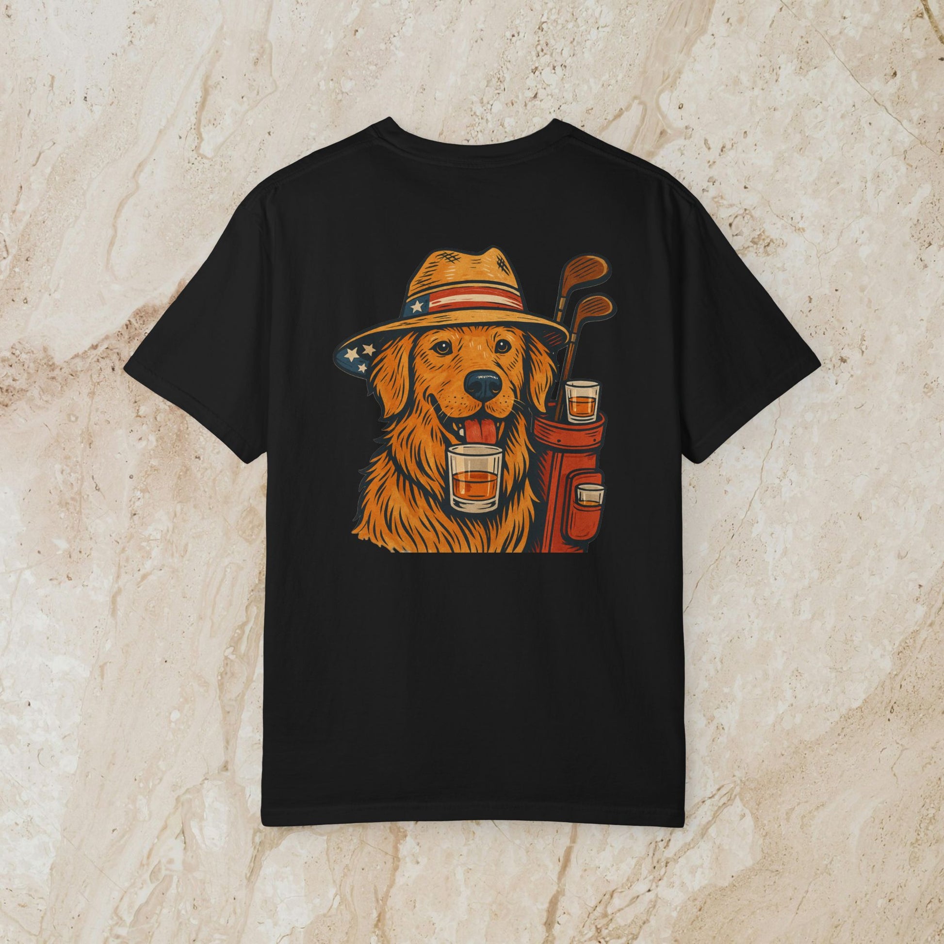 Golden Whiskey Dog Tee featuring a playful golden retriever in a hat with golf clubs and drinks, showcasing a unique vintage style.