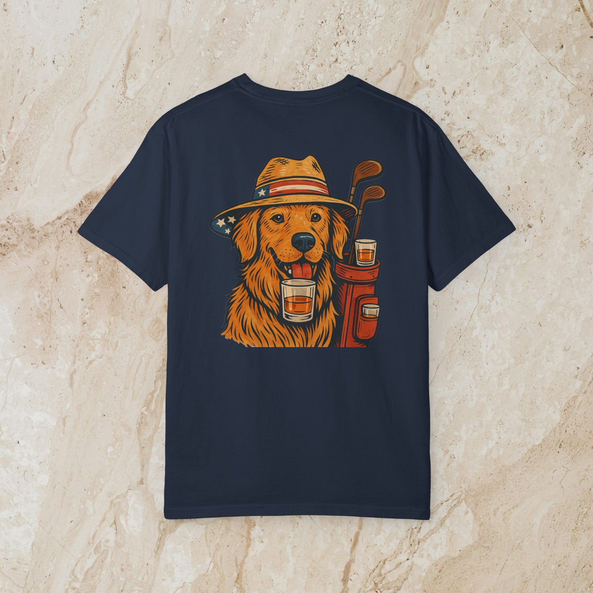 Golden Whiskey Dog Tee featuring an illustrated golden retriever wearing a hat and holding a drink, showcasing a unique vintage style on a navy background, perfect for dog lovers.