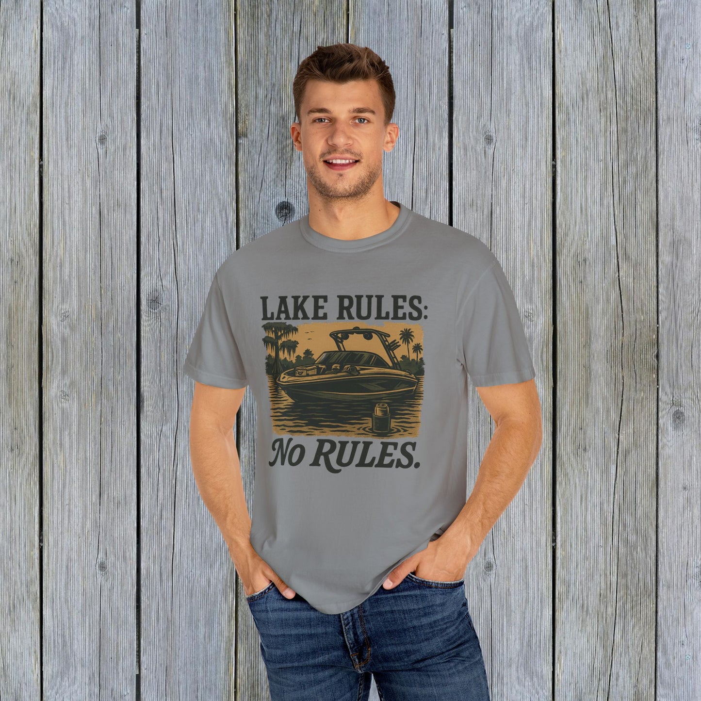 Model wearing the Unisex Garment-Dyed Lake Rules Tee, highlighted by its relaxed fit and lake-themed design, perfect for outdoor adventures.