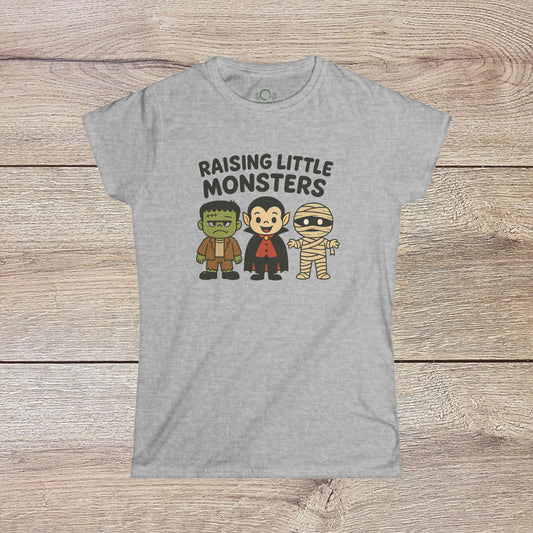 Gray Halloween Family T-Shirt showcasing adorable monster characters, with 'Raising Little Monsters' text. Ideal cute kids tee for festive occasions and Halloween costumes.