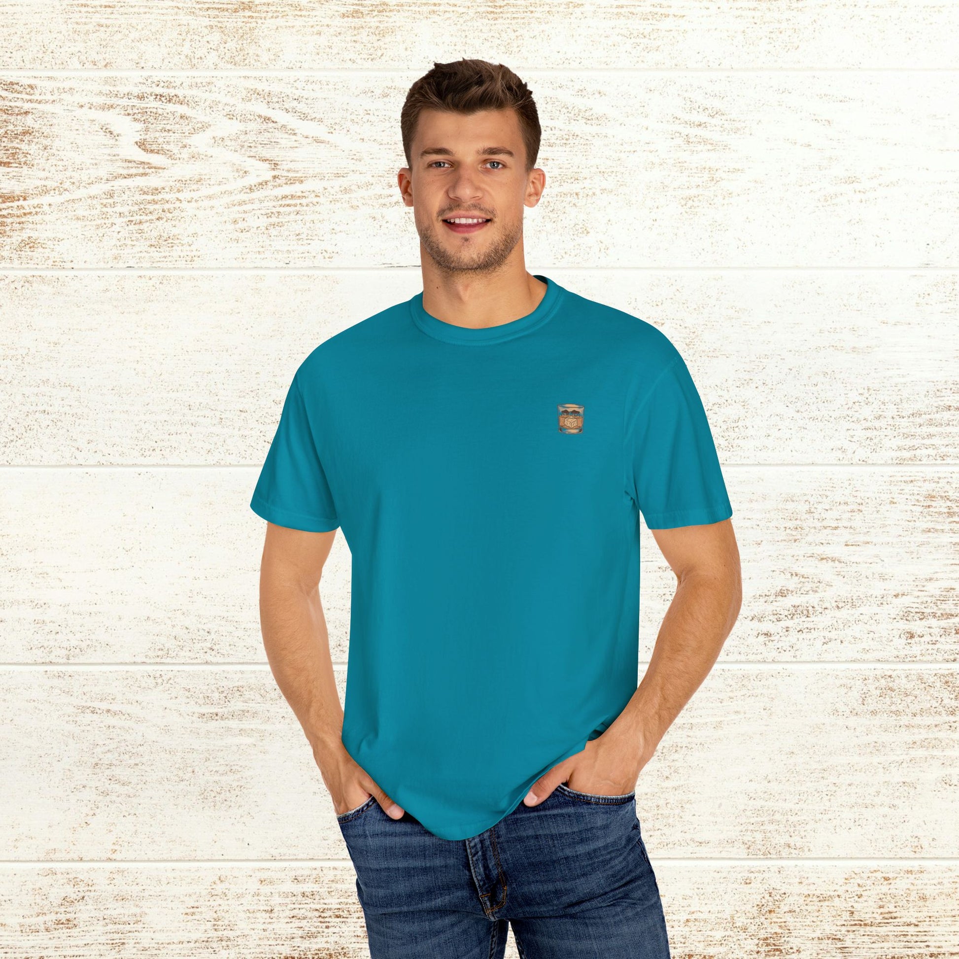 Model displaying the Rodeo On The Rocks Tee in bright turquoise, highlighting the comfortable fit and soft fabric, perfect for everyday fashion.