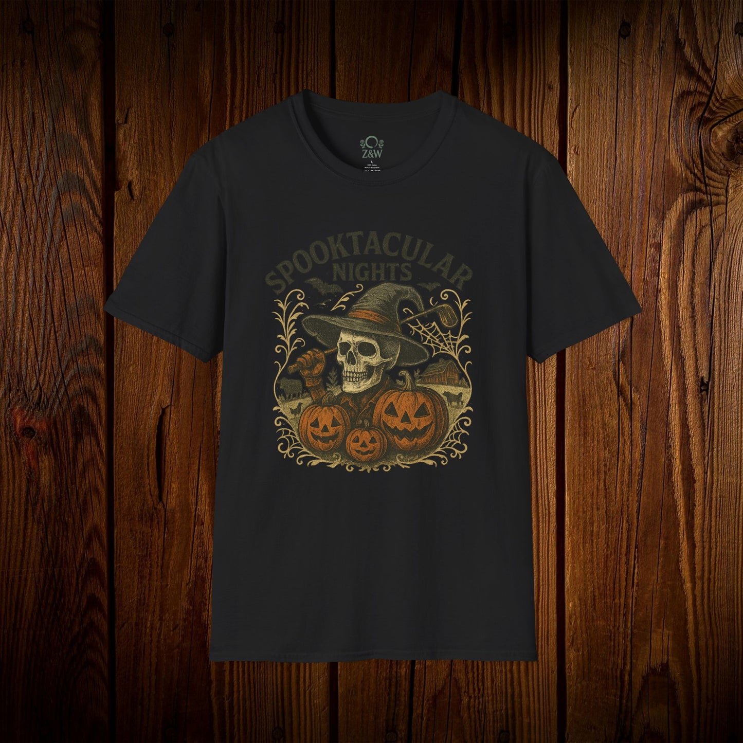 Black Spooktacular Nights Halloween T-shirt presented against a rustic wood backdrop, featuring a playful design of pumpkins and a skull, perfect for festive gatherings.