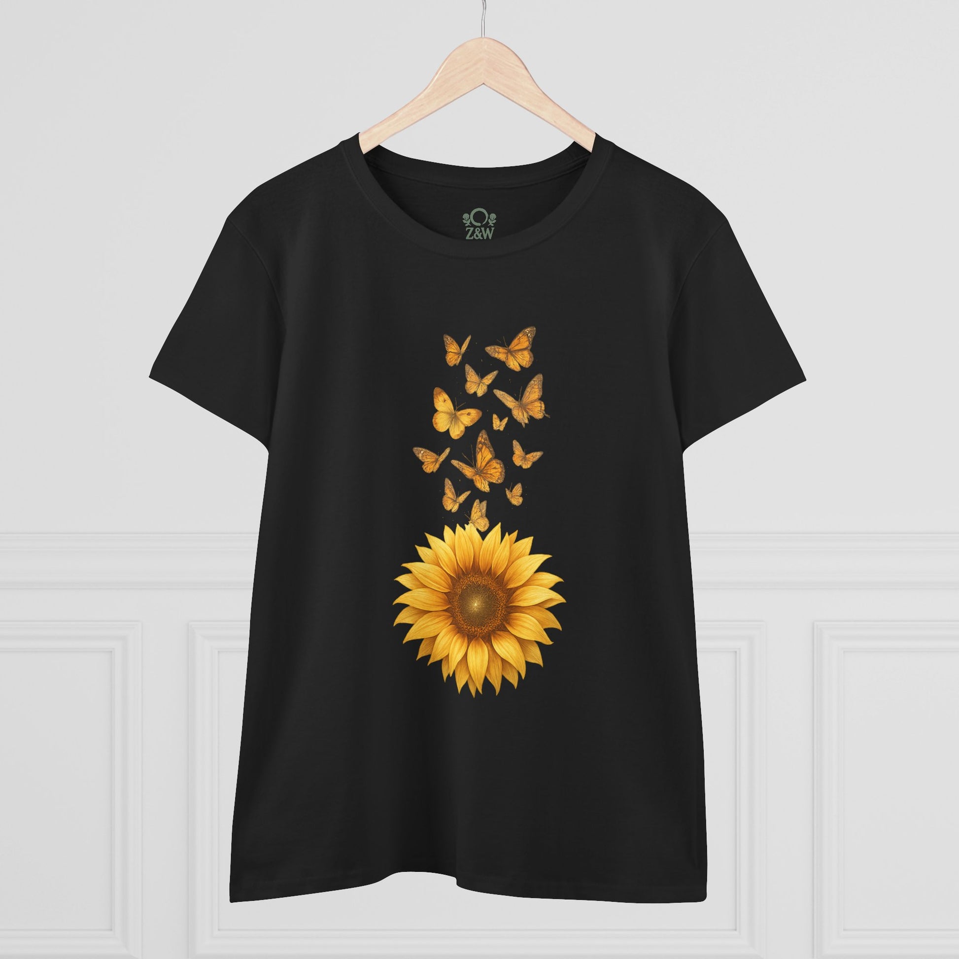 Sunflower & Butterflies Cotton Tee for Women displayed on a hanger against a white backdrop, featuring a striking sunflower and butterfly graphic, made with 100% soft cotton for comfort.