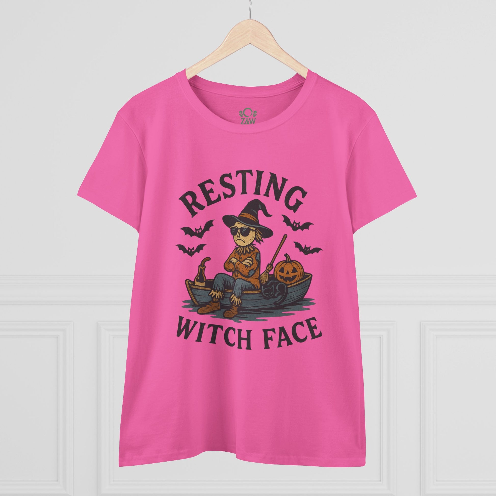 Resting Witch Face Halloween T-Shirt for Women in pink, featuring a whimsical witch graphic with pumpkins. Perfect for spooky season, this unisex funny cotton tee is a fun addition to any wardrobe.