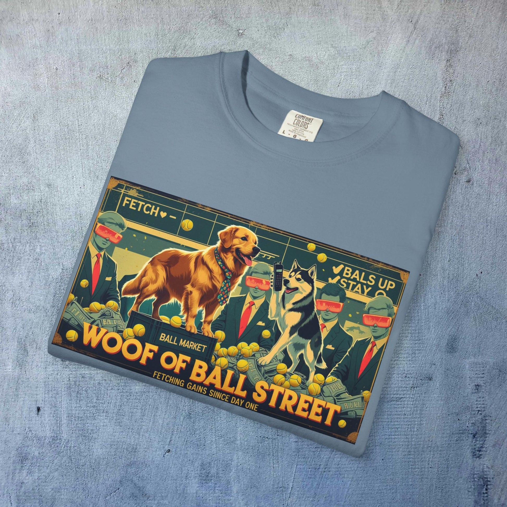 Folded view of the Sleek Woof of Ball Street T-Shirt in light gray with a vibrant dog theme graphic, perfect for adding a playful touch to any wardrobe.