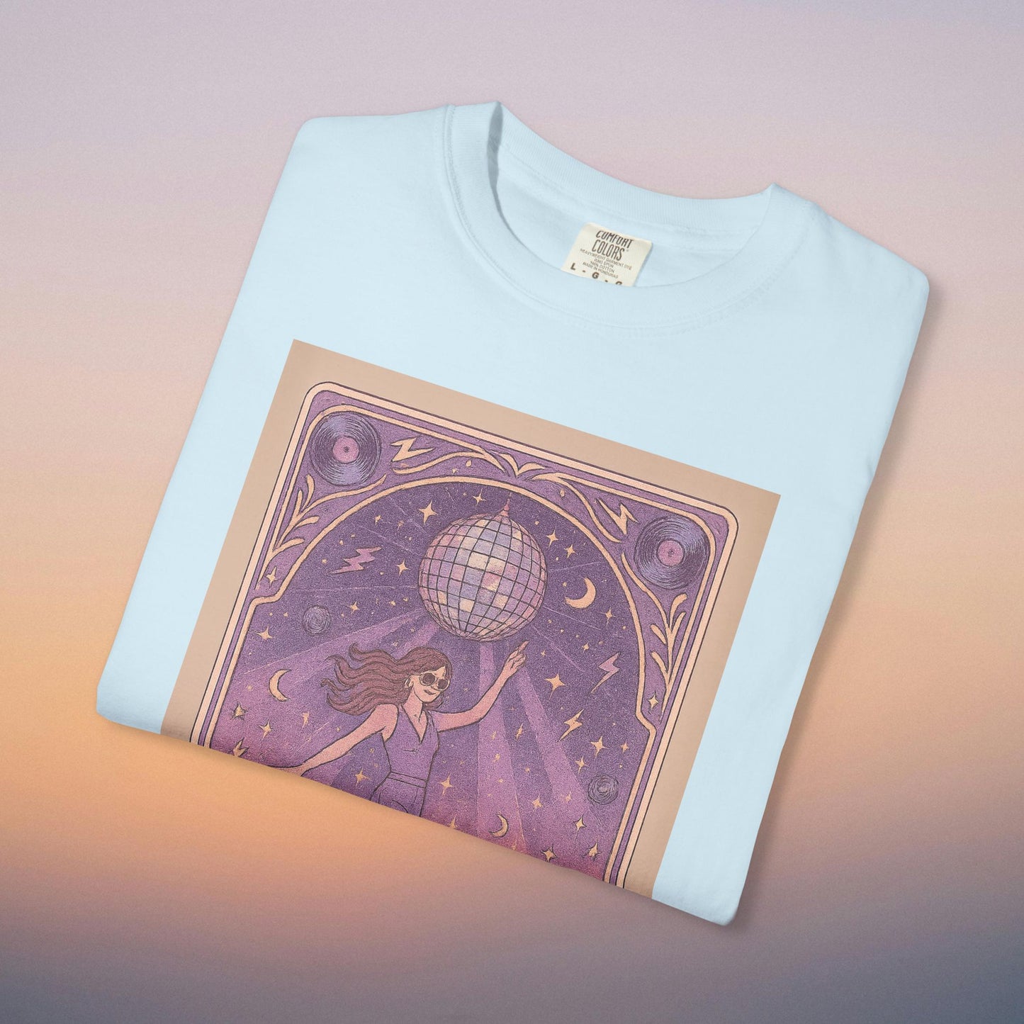 Groove Tarot Graphic Tee in pastel blue color, made from 100% ring-spun cotton, showcasing a unique graphic design with a disco ball and mystical elements, perfect for casual wear.