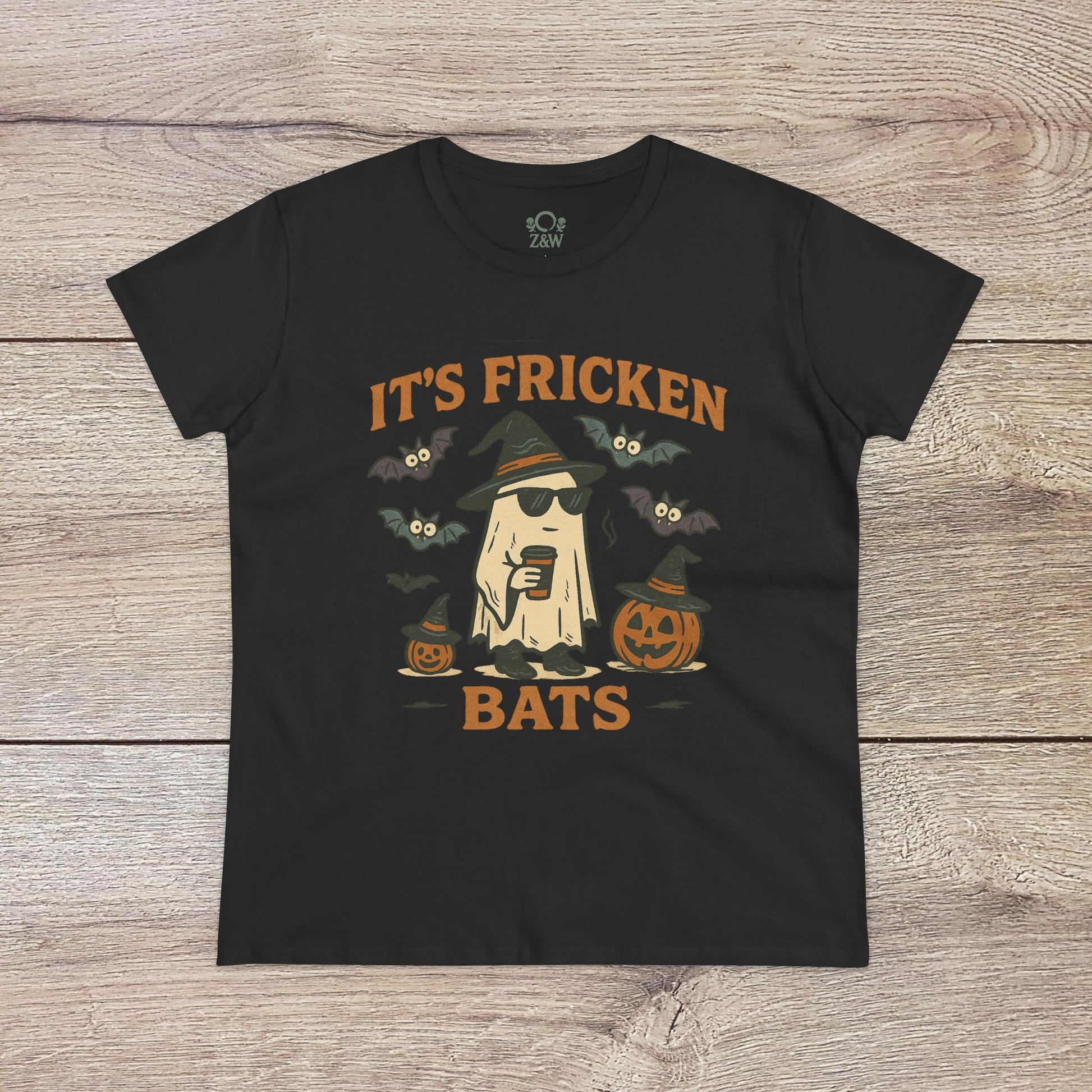 Halloween Unisex T-Shirt in black showcasing a graphic design of a cool ghost with a drink, bats, and pumpkins; crafted from 100% cotton, ideal for festive events.