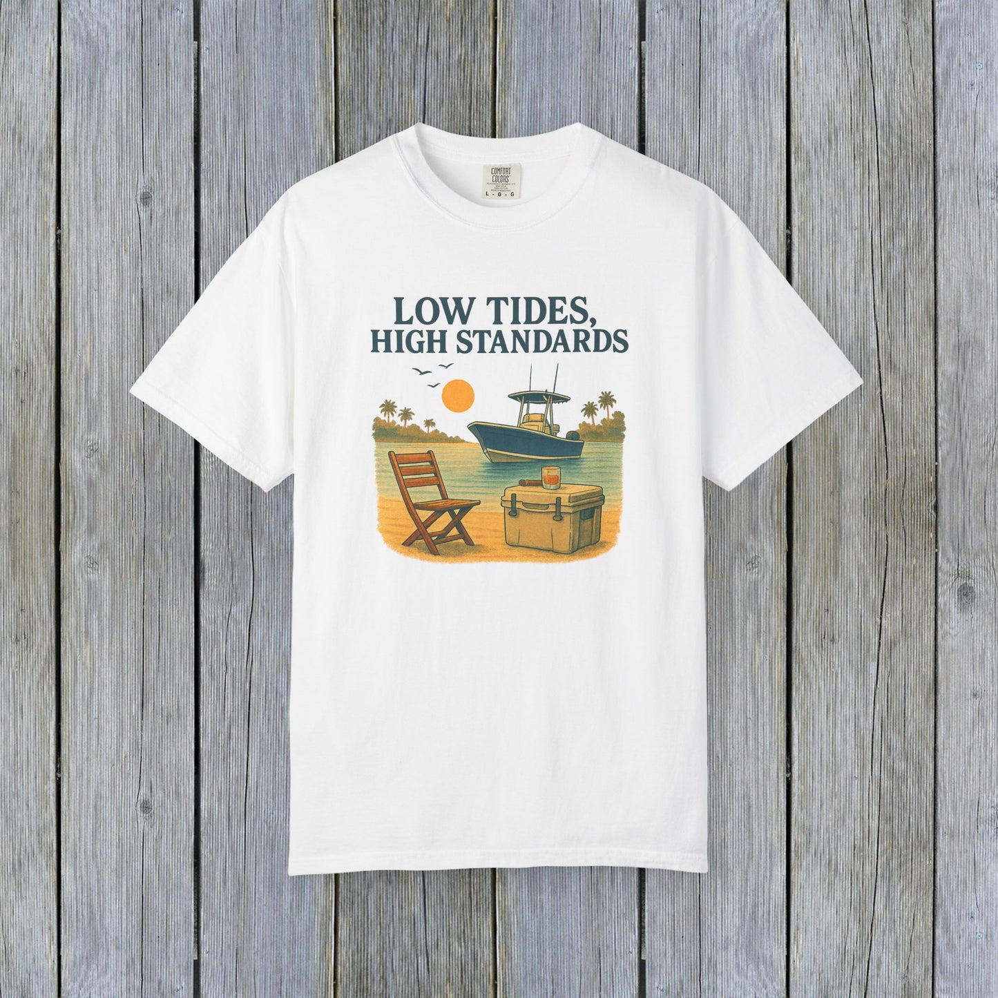 Garment-Dyed Low Tides High Standards T-Shirt in white, depicting a beach lifestyle with graphics of a boat and chair, a must-have for your casual wardrobe.