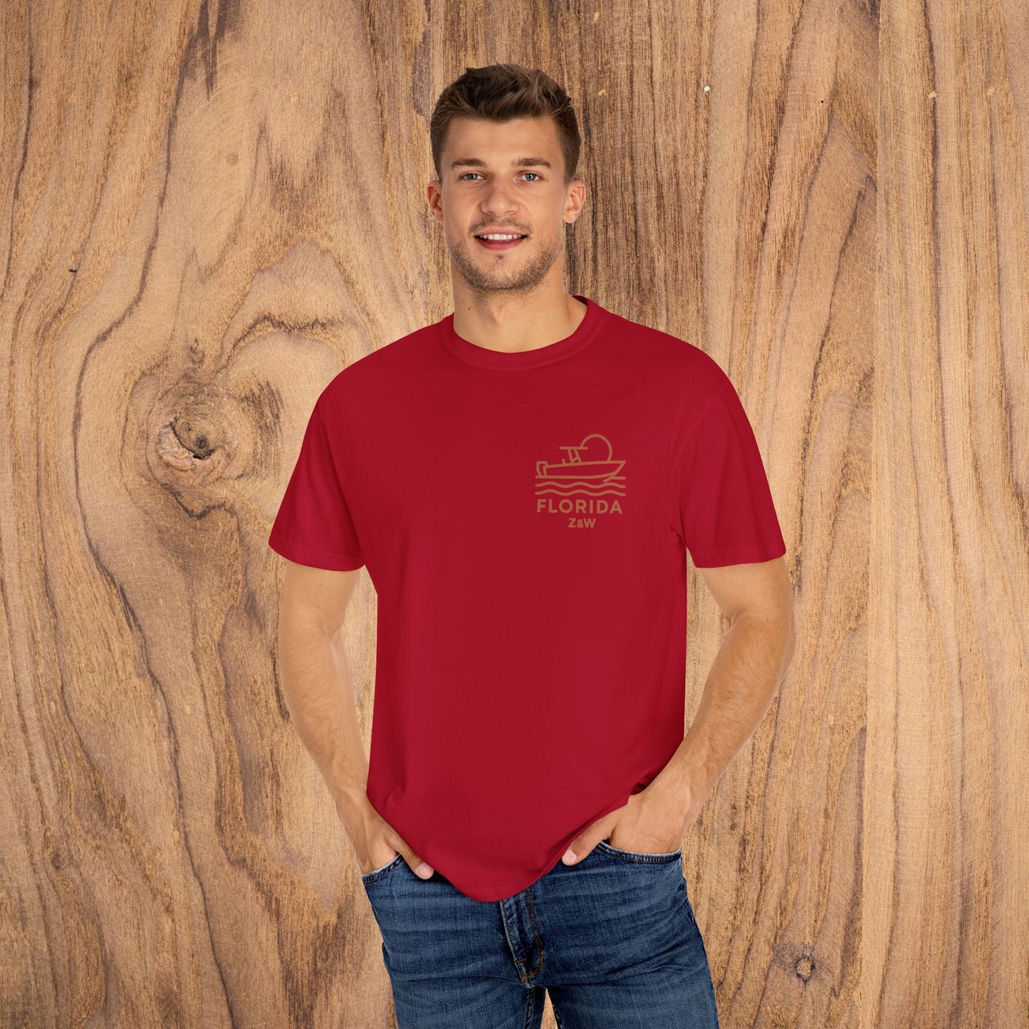 Unisex Florida Graphic Tee worn by a model in vibrant red, highlighting the stylish boat design for relaxed everyday wear.