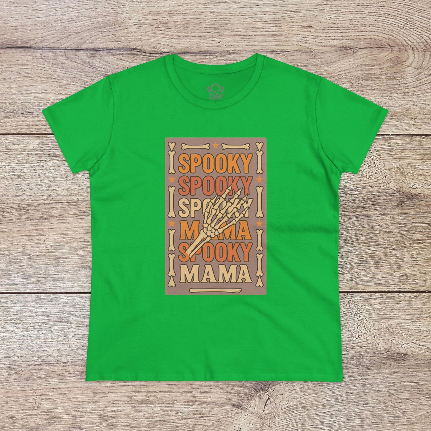 Spooky Mama Tee in green - Featuring a lively design with 'Spooky Mama' on soft cotton fabric. Perfect for a festive, casual look during Halloween or any casual outing.