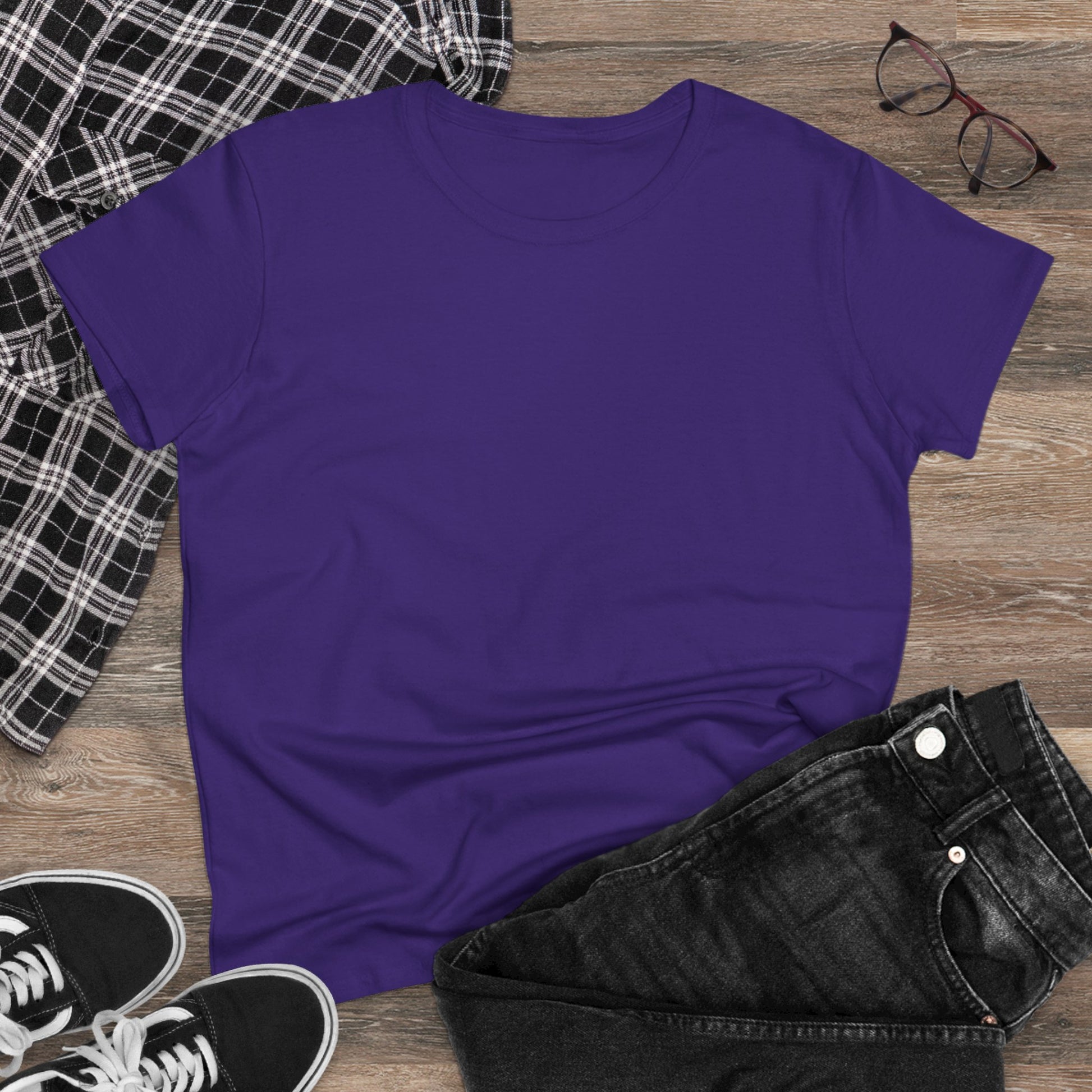 Flat lay of Unisex Dog Lover T-Shirt in purple with black jeans and a plaid shirt, showcasing a relaxed outfit for casual outings.