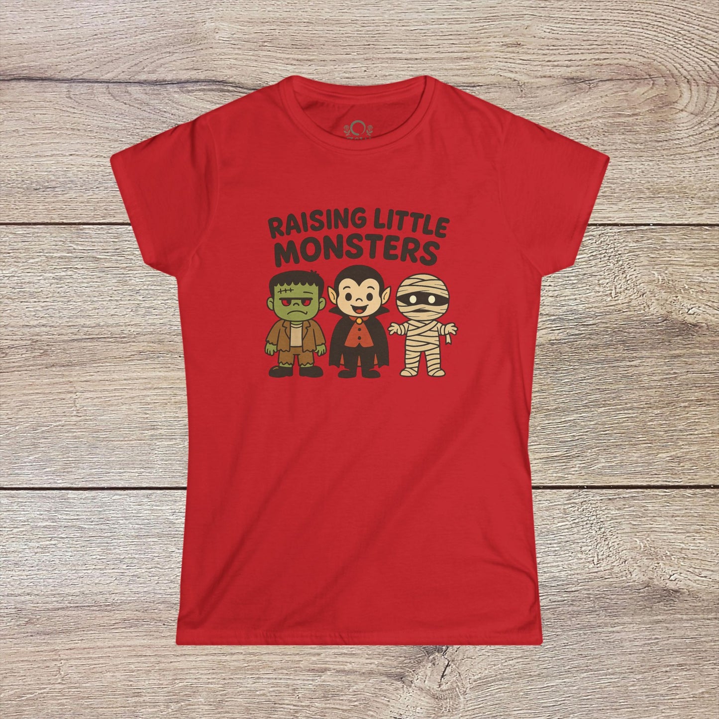 Red Halloween Family T-Shirt displaying cute cartoon versions of Frankenstein, a vampire, and a mummy, an excellent choice for kids' Halloween costumes - Raising Little Monsters Cute Kids Tee.