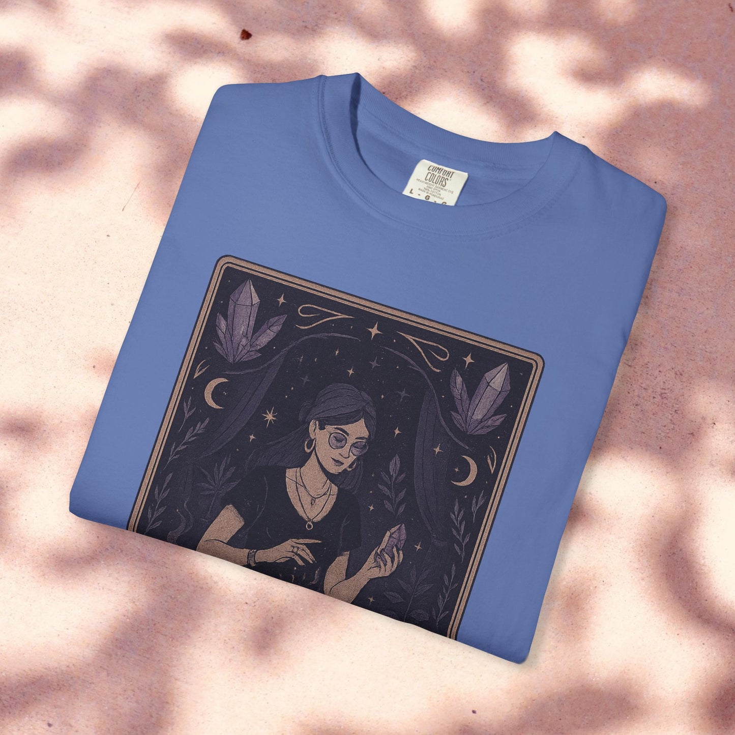 Intuitive Tarot Tee in vibrant blue with an artistic depiction of a woman engaged in tarot reading, stylish and comfortable for tarot aficionados.