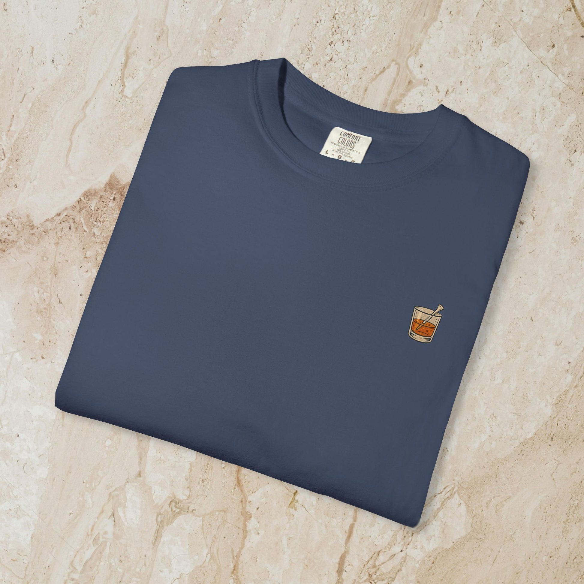 Golden Whiskey Dog Tee - Unique Vintage Style, with a whiskey glass pocket design on a navy colored 100% cotton tee, perfect for casual wear.