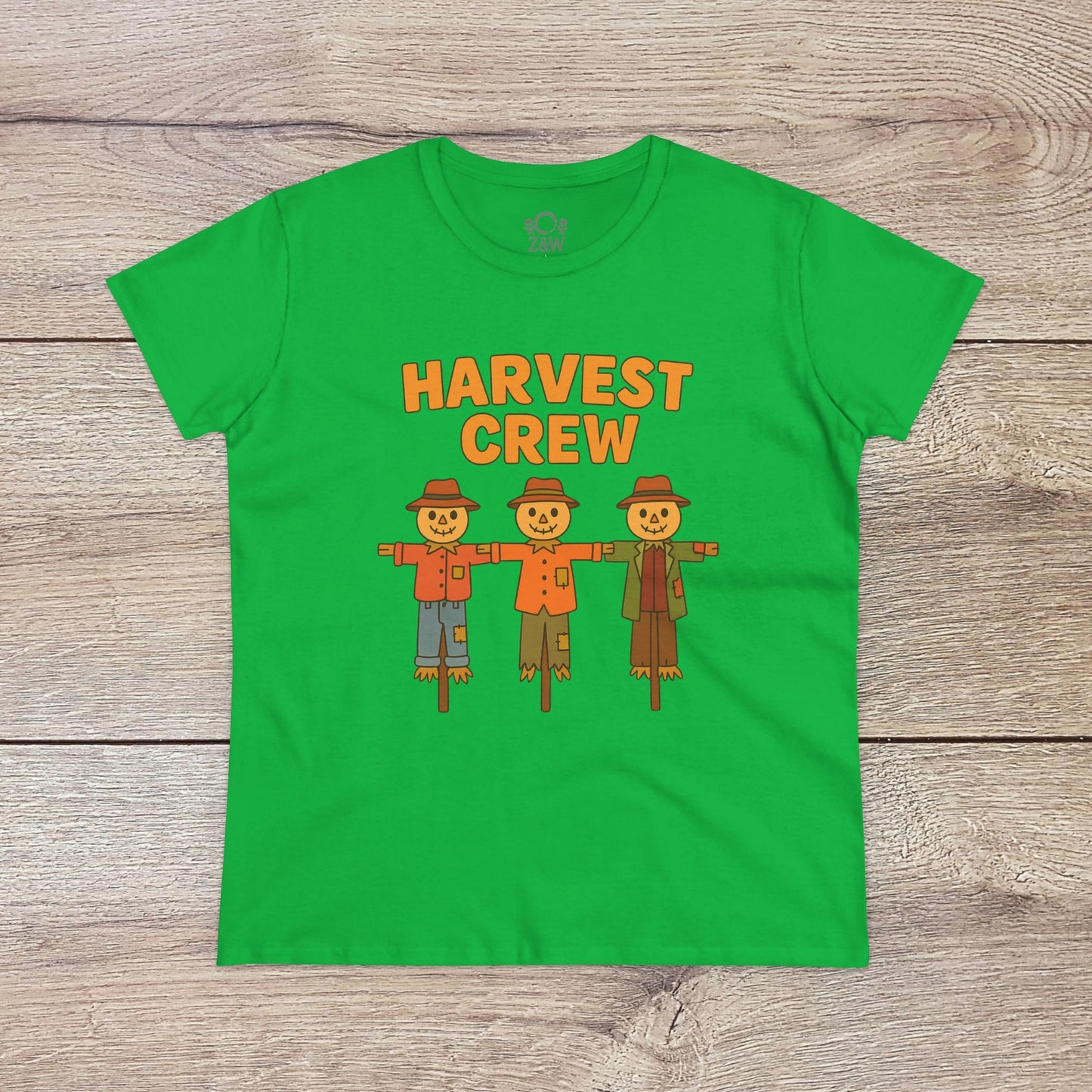 Harvest Crew Halloween T-Shirt in bright green with a playful illustration of three scarecrows, perfect for Halloween festivities. Made from 100% ring-spun cotton for softness.
