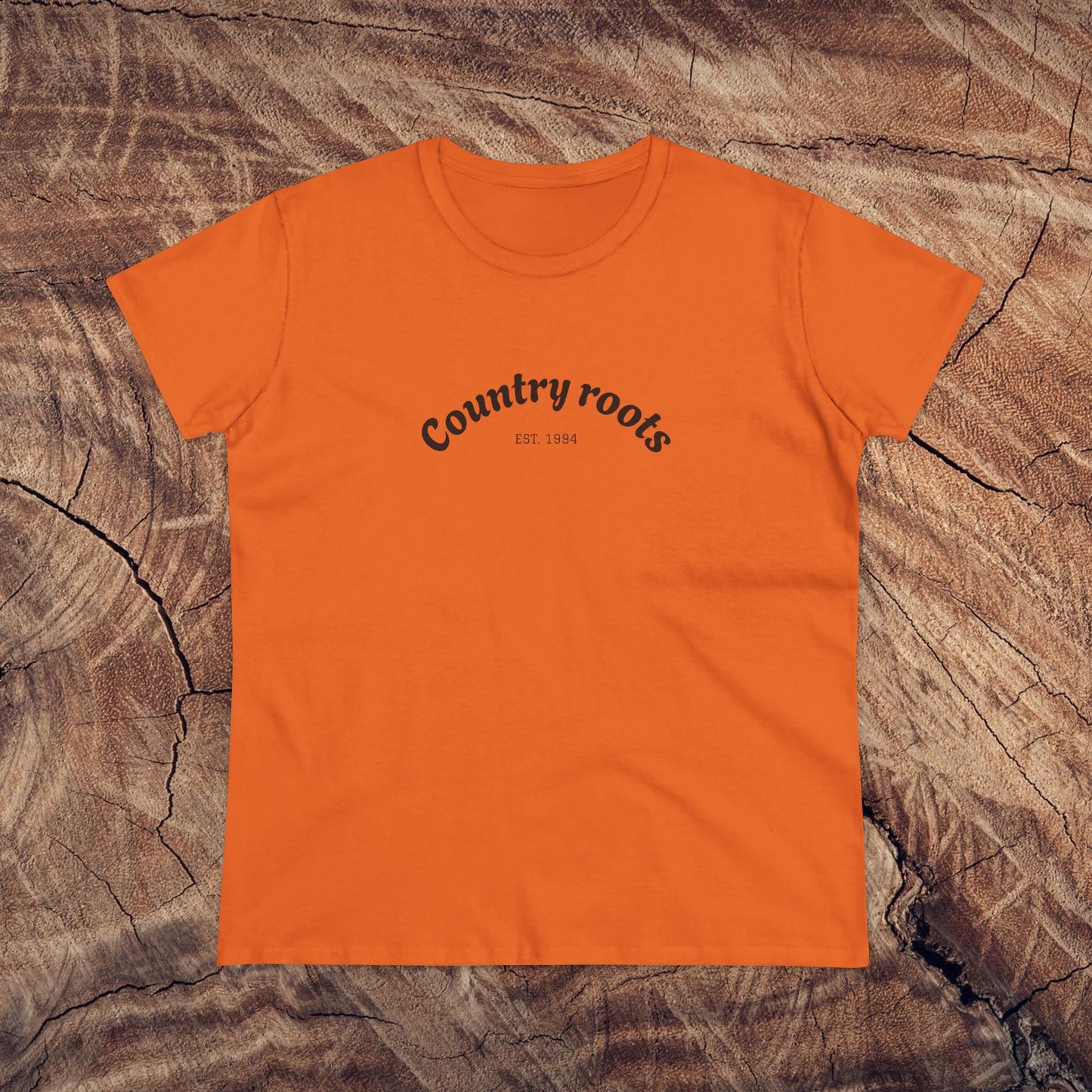 Country Roots Cowgirl Tee in bright orange, featuring a trendy 'Country roots' logo, perfect for a fashionable yet relaxed outfit.