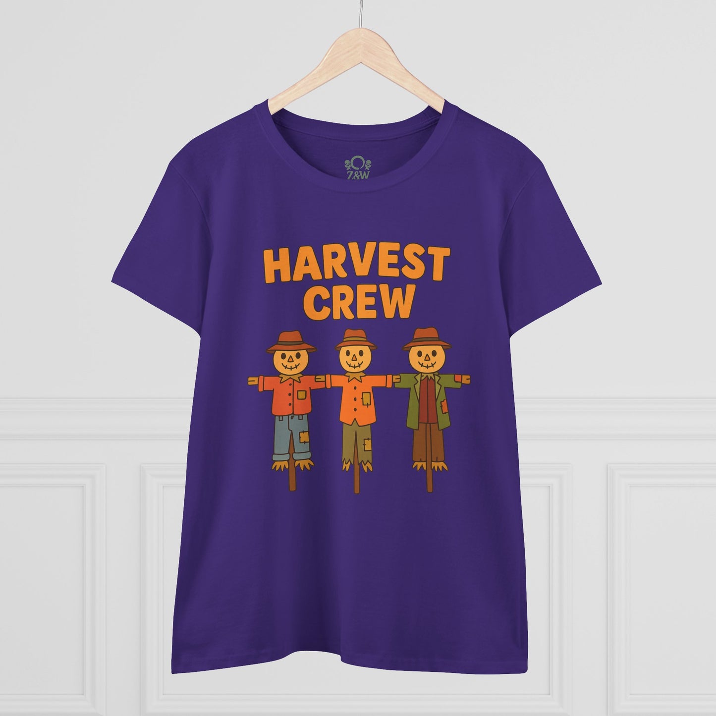 Front view of the Harvest Crew Halloween T-Shirt - Soft 100% Ring-Spun Cotton in purple, showcasing three cheerful scarecrow characters with the text 'HARVEST CREW'.