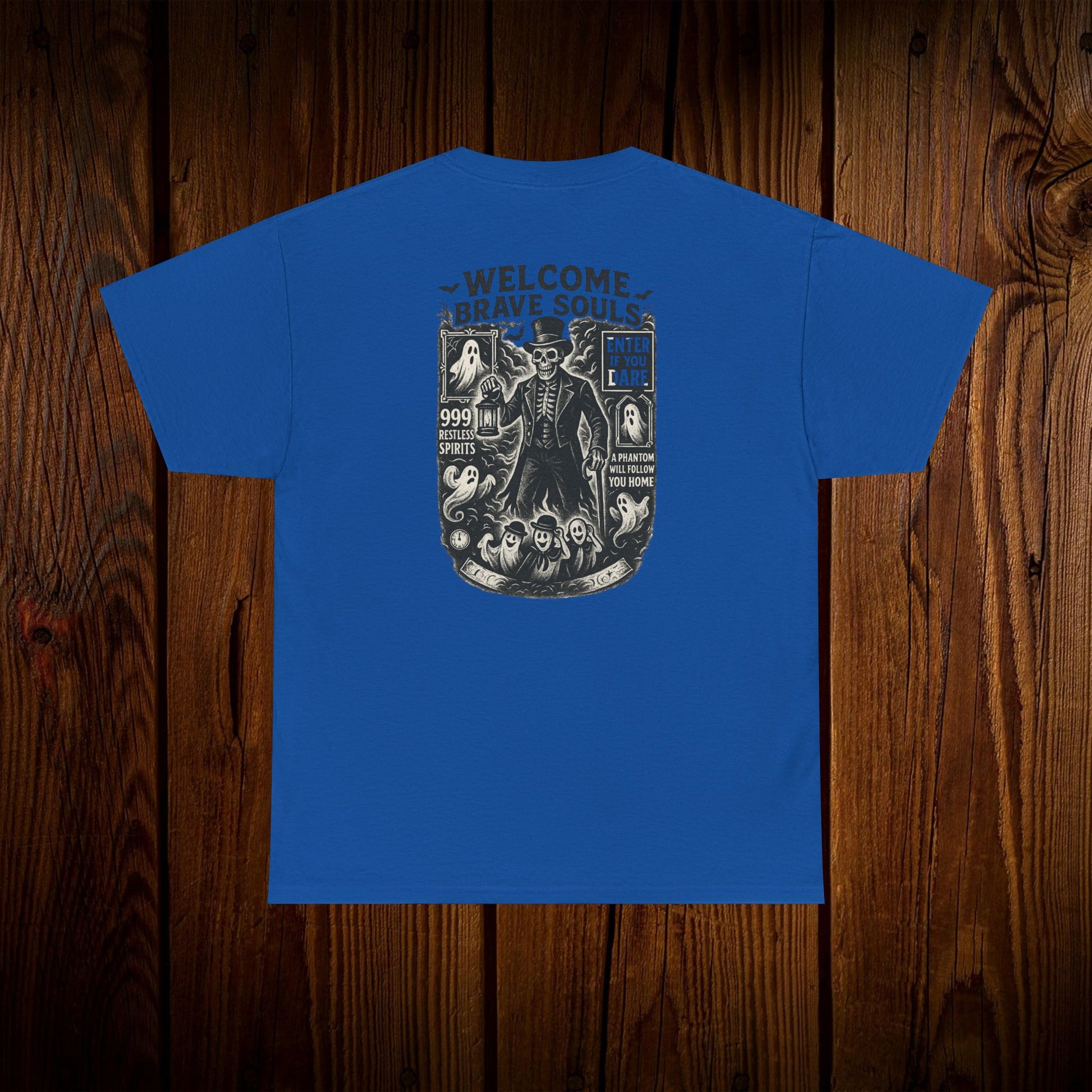 Spooky Halloween Graphic Tee - Unisex Cotton Shirt in vibrant blue, featuring the eerie 'WELCOME BRAVE SOULS' design on the back, ideal for spooky season wear.